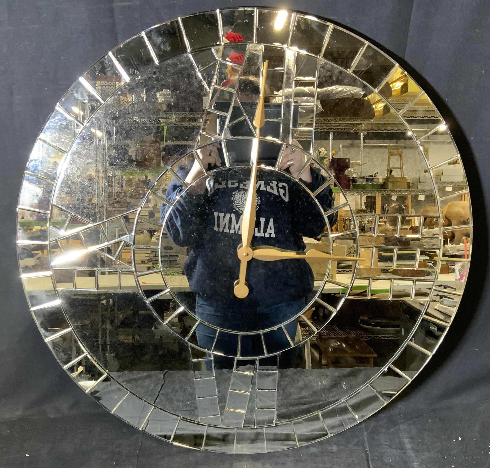 Oversized Mirrored Wall Clock: Oversized mirrored wall clock, labels to reverse read ‘Ballard Designs’ ‘Vendor Code 51099, Date Finished good: November 2011 Carb Phash 1 Complaint’ and a label with hanging instructions, mea