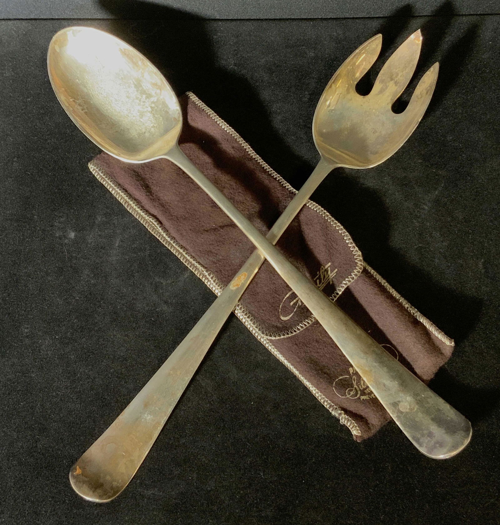 2 STERLING SILVER Vntg Hallmarked Serving Utensils: Vintage sterling silver serving utensils, spoon and fork, that have hallmarks along the handle. The hallmarks include the numbers 4 and 8, as well as the letter ‘G’ and a four leaf clover symbol.