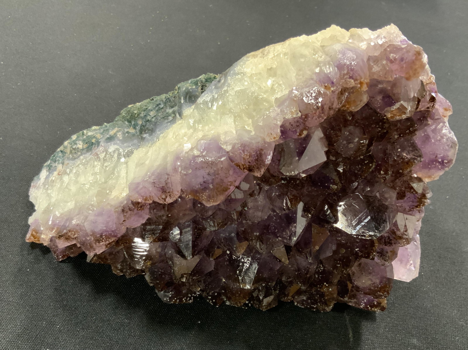 CURATED KRAVET New Large Purple Quartz Geode: New and packaged merchandise donated by Curated Kravet, lot includes a large purple Quartz crystal geode, item has thick layers of white and gray blue to the sides, items new in wrapping, perfect for 