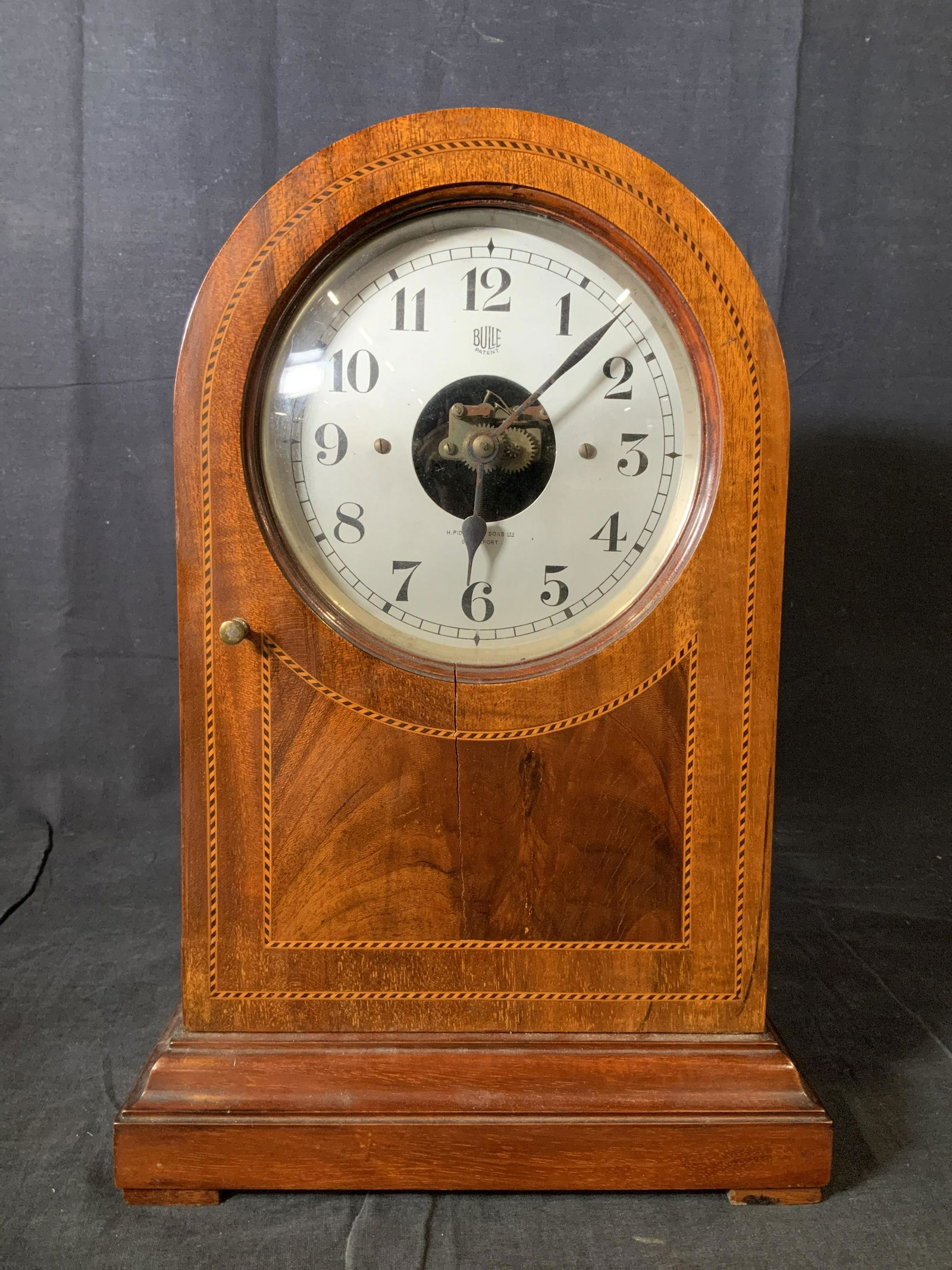 Vintage H PIDDUCK & SONS Mantel Clock: Vintage H PIDDUCK & SONS Mantel Clock, possibly antique, inscriptions read ‘Bulle Patent’ and ‘H PIDDUCK & Sons Ltd Southport’, measures 14 1/8 x 9 1/2 inches at widest point, some surface wea