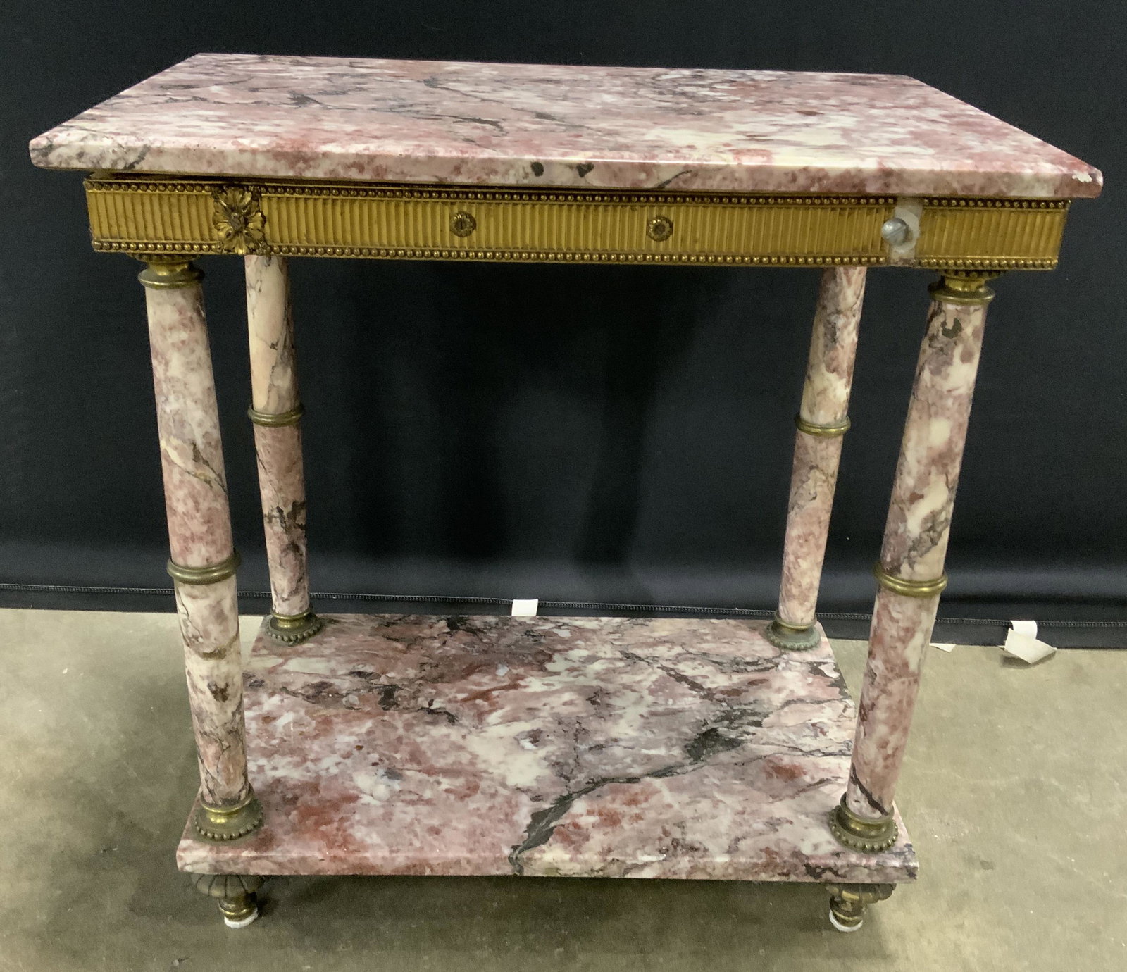 Antique Marble End Table: Antique marble end table. Tabletop is removable, trim around tabletop is brass and secured through screws, feet are brass. Platform supporting top is wood. Measures approx 22 inches H, 22.5 inches W, 