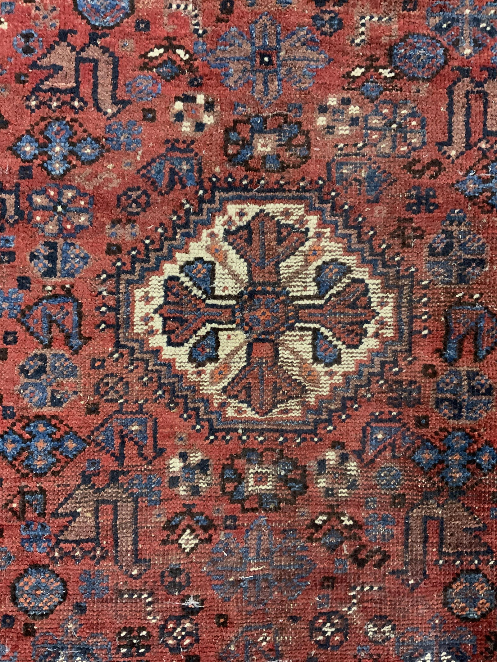 Vintage Fringed Area Rug: Vintage area rug, ends are fringed. Possibly handmade. Pattern is multi toned. Measures approx 67 inches long, and 44 inches W. Wear is consistent with age and use, pulling and fraying present. Area r