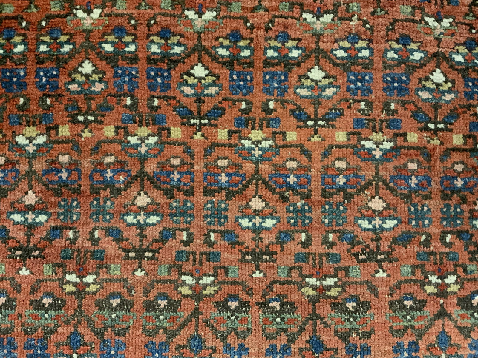 Antique Wool Runner: Antique wool runner, possibly Persian, ends were once fringed. Decorated with a multi toned floral pattern. Measures approx 89 inches long, and 39 inches W. Wear is consistent with age and use, loss p