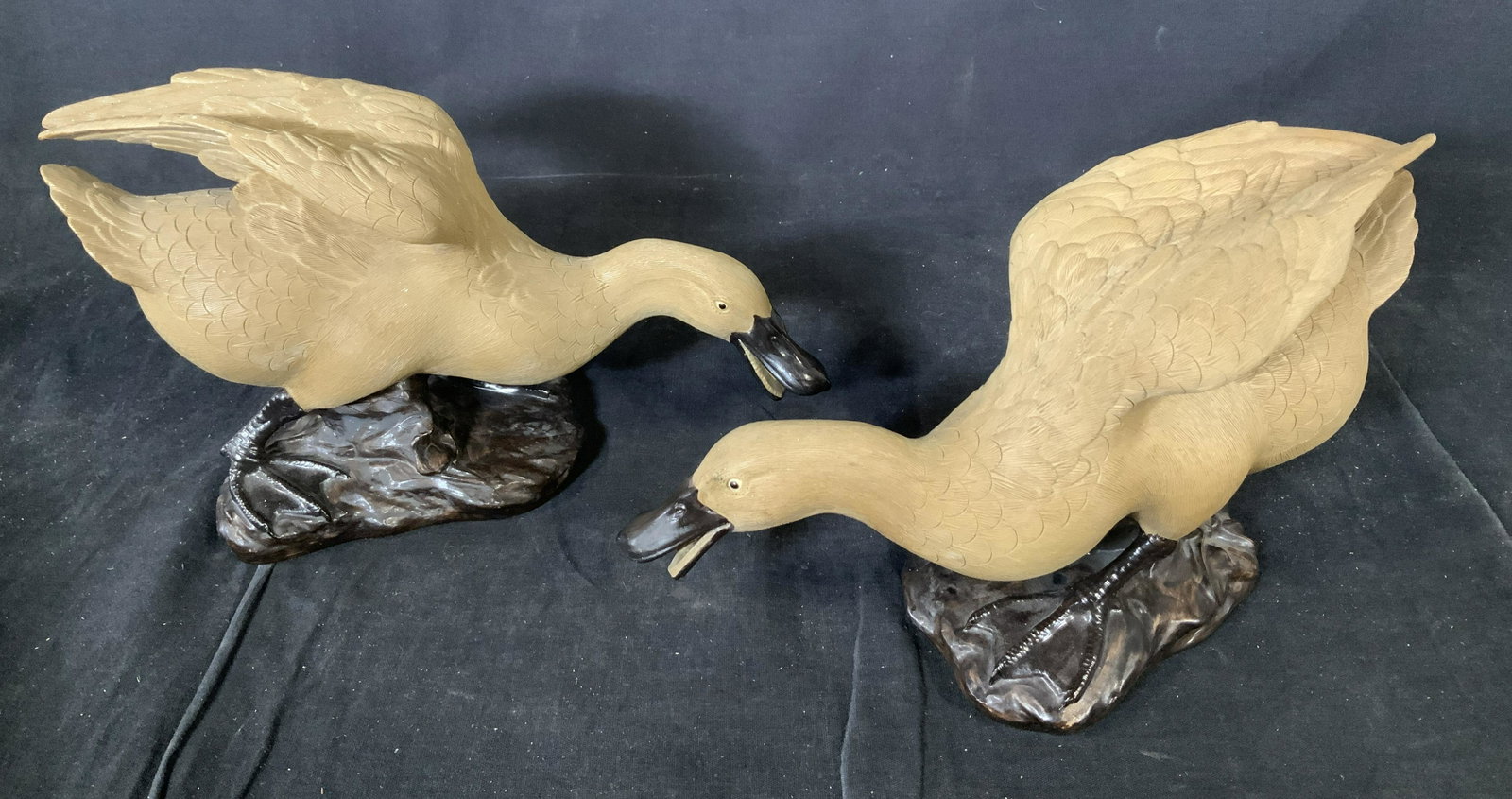 Pair Ceramic Geese Sculptures, China: Pair Ceramic Geese Sculptures, China, stamp to base reads ‘Made in China 42’, subject geese on rocks, both measure 6 1/2 inches tall x 10 1/2 inches at widest point, some surface wear but overall 