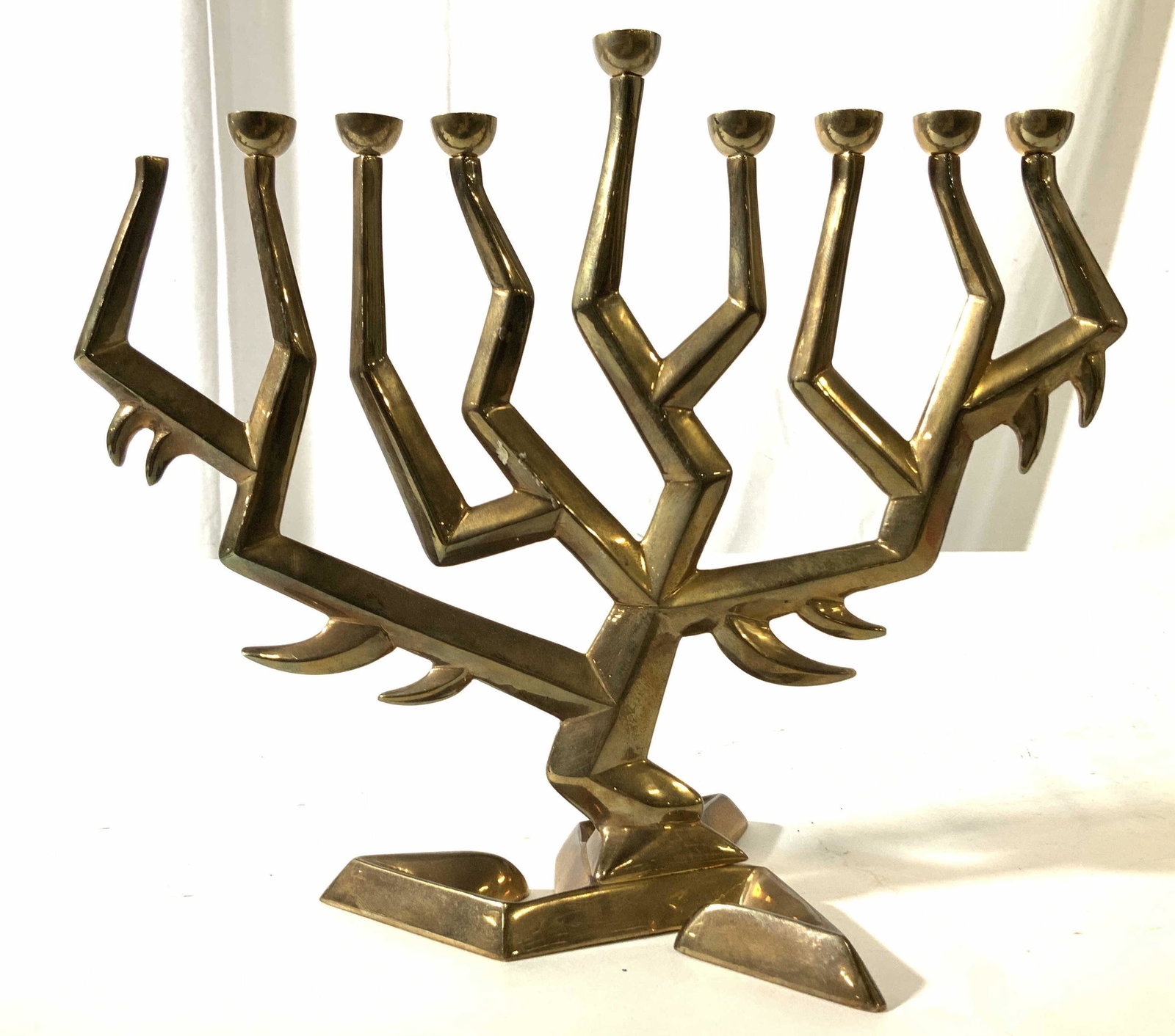 Weighty Sculpted Brass Menorah, Israel: Judaica, Hebraica, angular modernist sculptural menorah, Hanukkah accessory, Israeli arts and crafts, Judaica table ware, measures 8.5 inches width 10 inches depth app 5.5 inches, Jewish ceremonial ac