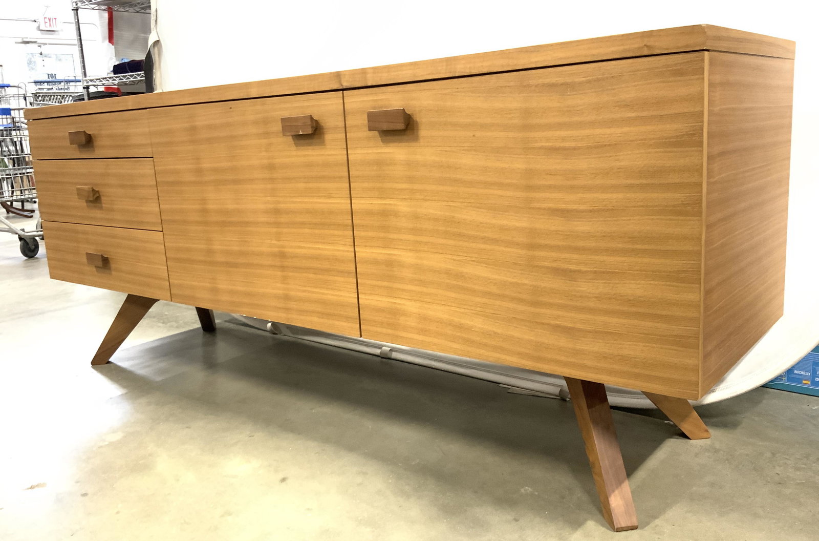 MATTHEW HILTON CASE FURNITURE Cross Oak Sideboard: Backside of piece is labeled CASE FURNITURE DESIGNER MATTHEW HILTON. Piece is tan toned and appears to be wooden. Originally from DESIGN WITHIN REACH. Credenza contains 3 drawers & 2 cabinet storage s