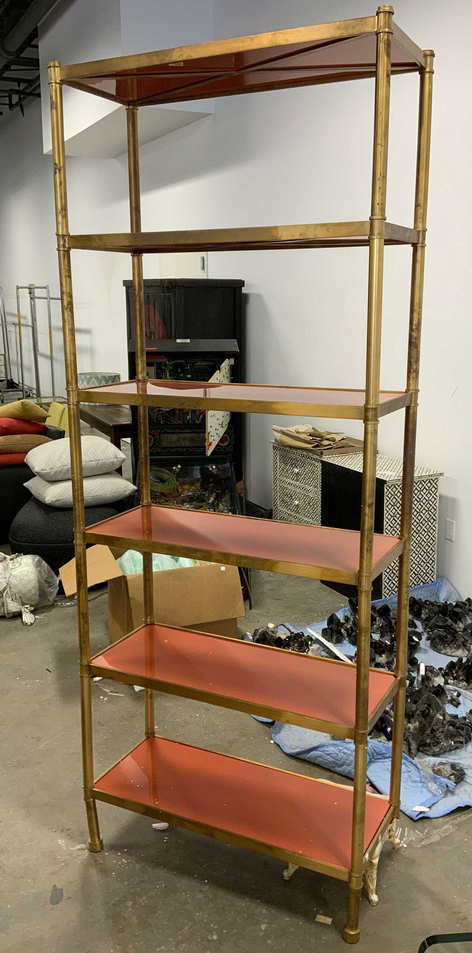 Vintage Brass & Lacquered Shelves, 7.5ft Ht: Vintage shelves. Frame is crafted from brass, shelves appear to be wooden and lacquered. Shelves have been colored in pumpkin tones. 6 wooden shelves slot into the brass frames. Shelving rests on four