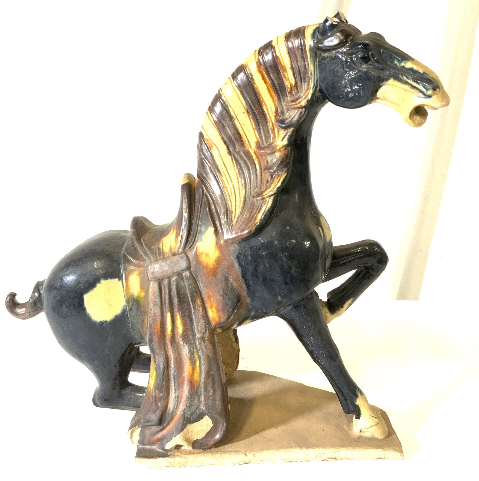Vintage Asian Ceramic Porcelain Horse Figural: Vintage possibly antique Asian Horse appears to be porcelain possibly ceramic. Blue Gold Cream thick drip coated glazing,well defined musculature and facial expression to horse, Piece appears to possi