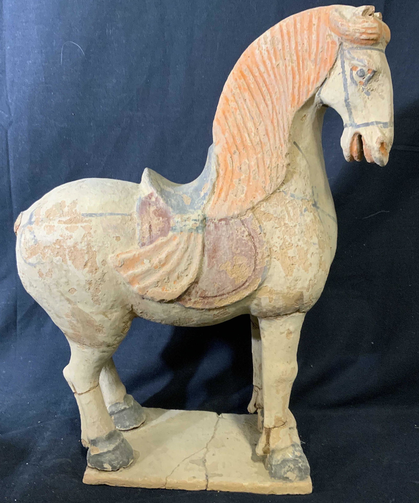 Vintage Hand Painted Earthenware Horse Sculpture: Vintage possibly antique earthenware horse sculpture. Depicts a horse equipped with a saddle. Detailing is hand painted. Measures approx 16.75 inches H, and 14 inches W. Wear is consistent with age an