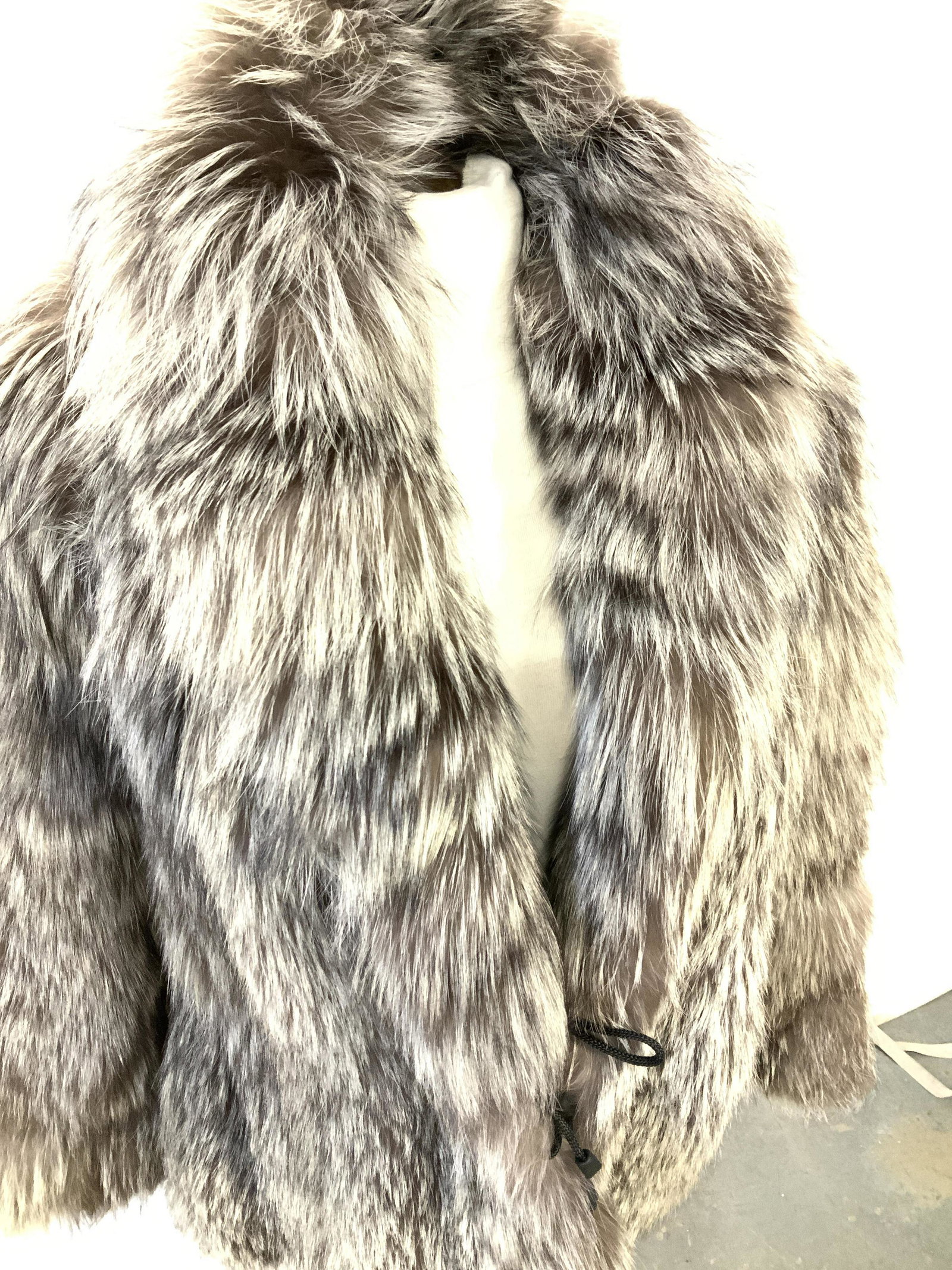 Luxury FIX FUR Jacket with Waist Cinch: Silver- brown FOX FUR JACKET, waist length, loop and hook at waist along with cinch rope tightening or loosening at waist. Clad leather on underside of shawl collar. Modern Bespoke piece with name Lex