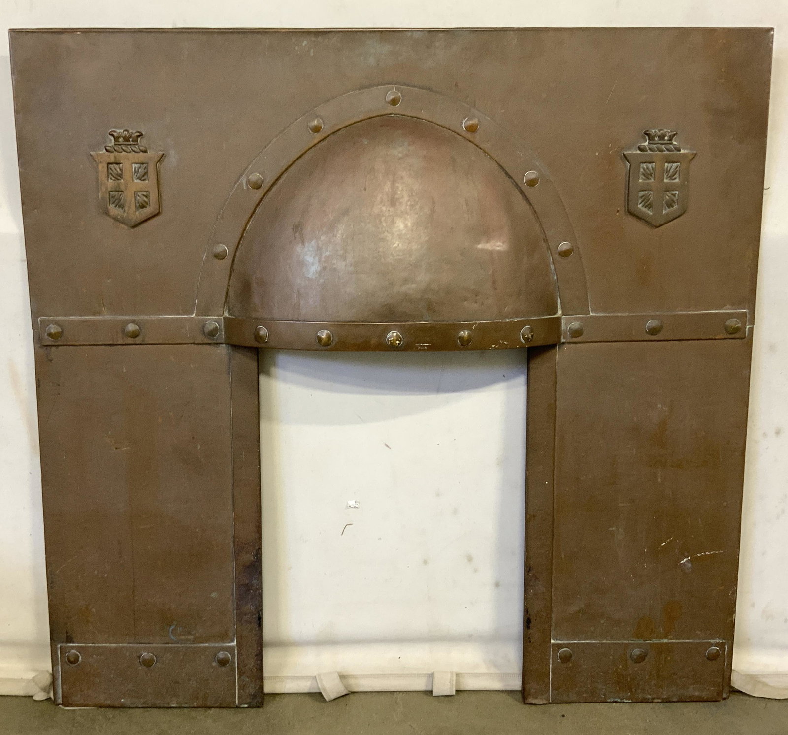 Antique Copper Fireplace Mantel: Victorian copper over steel, fireplace mantle. Original Patina, piece is VERY HEAVY. A coat of arms/ family crest can be found on either side of the fireplace opening, 40.25 inches H, and 42.25 inches