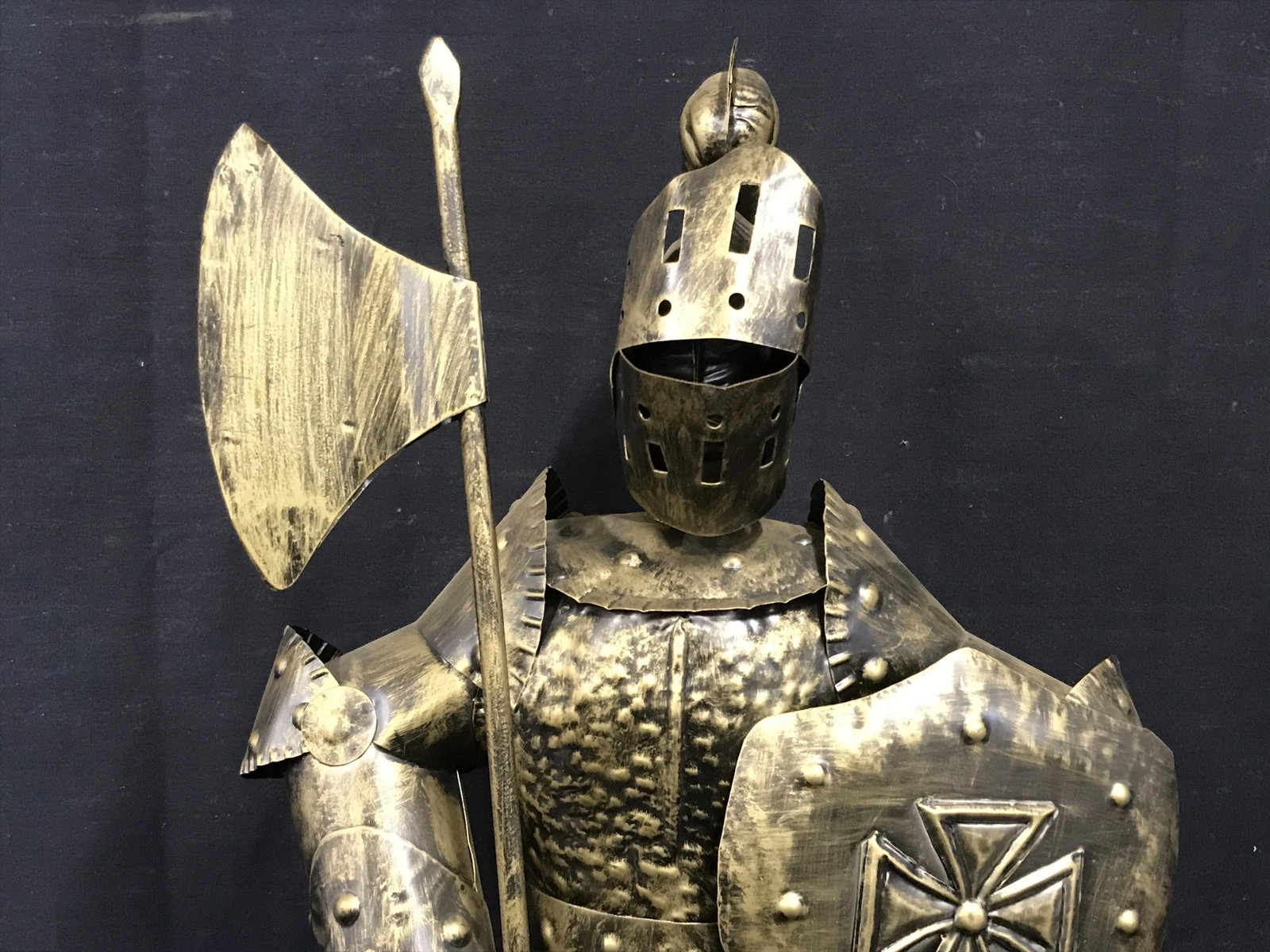 Metal Statue of Knightly Armor with Halberd: Metal statue of knightly armor with Halberd, no apparent signatures or stamps, subject a set of knightly armor holding a Halberd and shield in other hand, hollow statue, made of a black toned metal pa