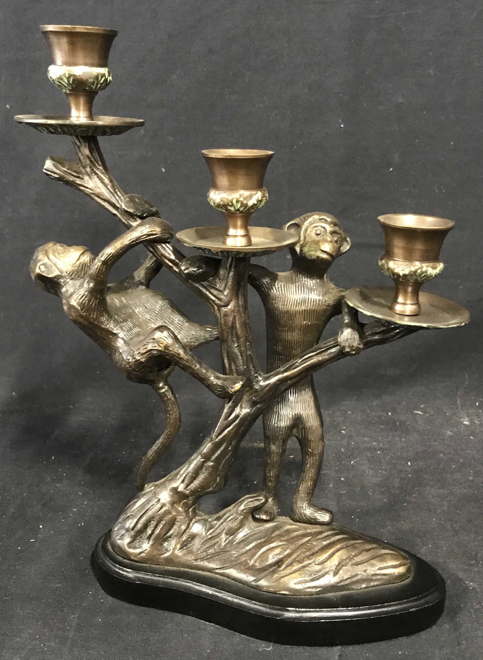 Bronze Monkey Candelabra: Bronze monkey candelabra, possibly bronze or bronze plated, no apparent stamps or marks, subject a candelabra made of tree branches with two monkeys climbing it, bronze piece attached to a black paint