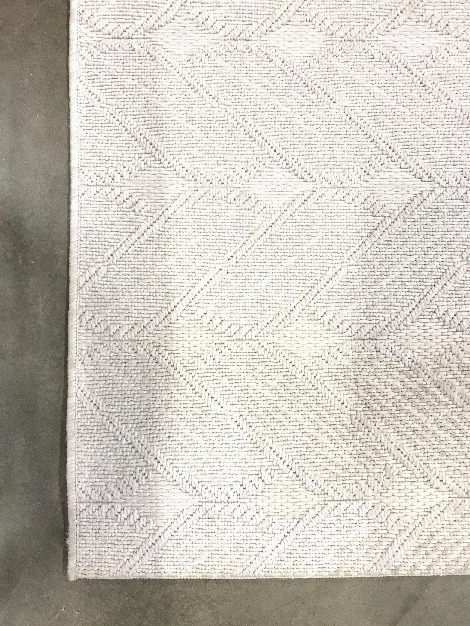 BALLARD DESIGNS Wool Area Rug: Piece has tag on underside which reads BALLARD DESIGNS. Rug is wool. Piece has a slate cream tone. Rug Measures approx 91 inches long 60 inches wide. Rug, carpet, wool rug, Ballard designs rug, area r