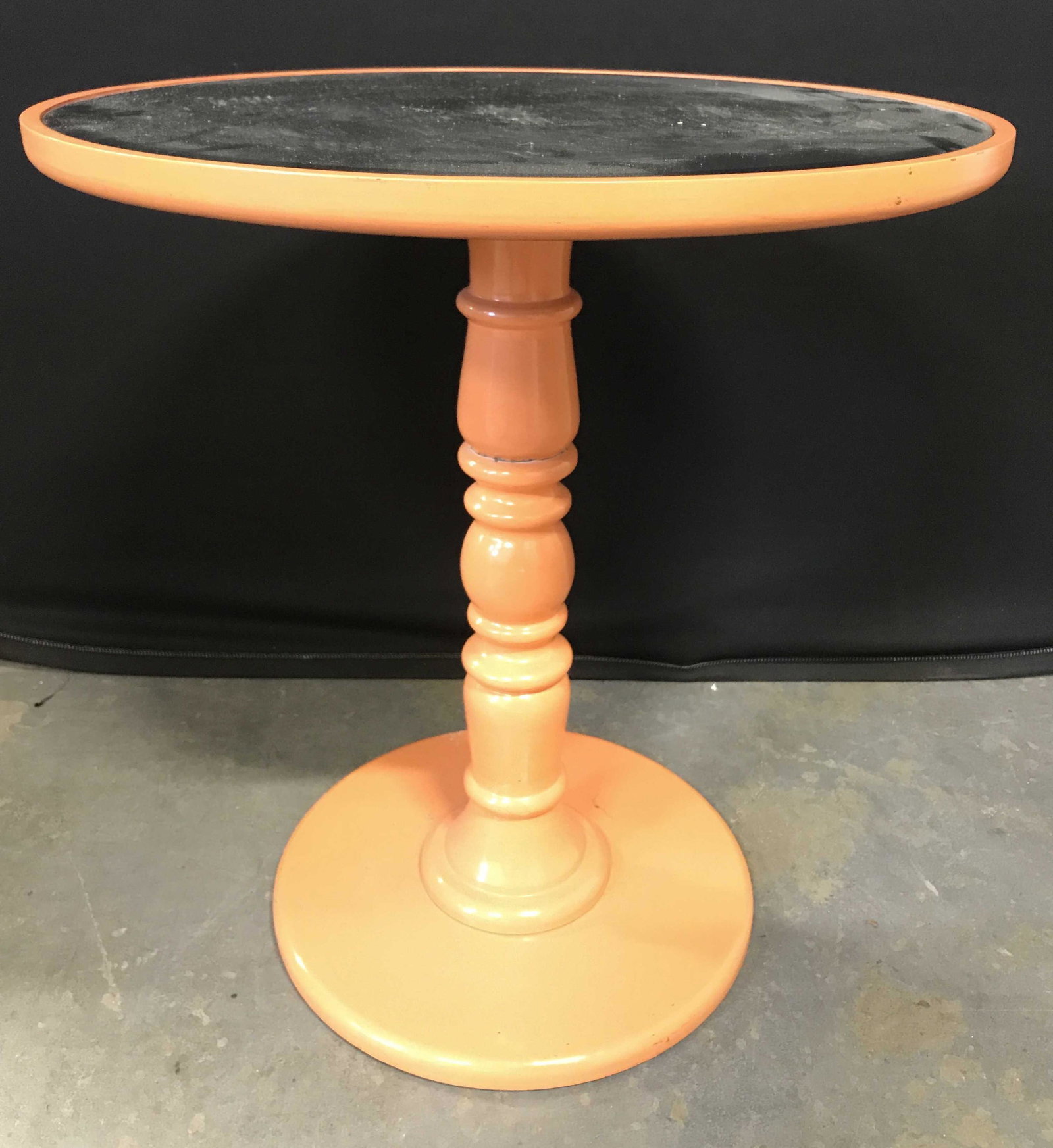 Vintage Circular Beveled Mirror Top Side Table: Table has circular beveled glass top. Piece appears to possibly be wooden. Side table is orange toned. Piece is Pedestaled. Table, side table, mirror top table, glass top side table, vintage side tabl