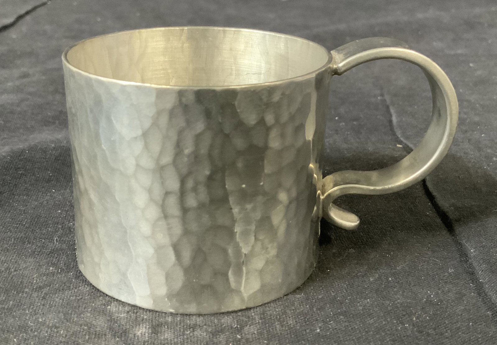 Signed Hammered Metal Cup Mug: Signed Hammered Metal Cup, inscription to base illegible, measures 2 inches tall x 3 1/2 inches at widest point, some surface wear but overall in good condition Metal, metalware, cup, vessel, tablewar