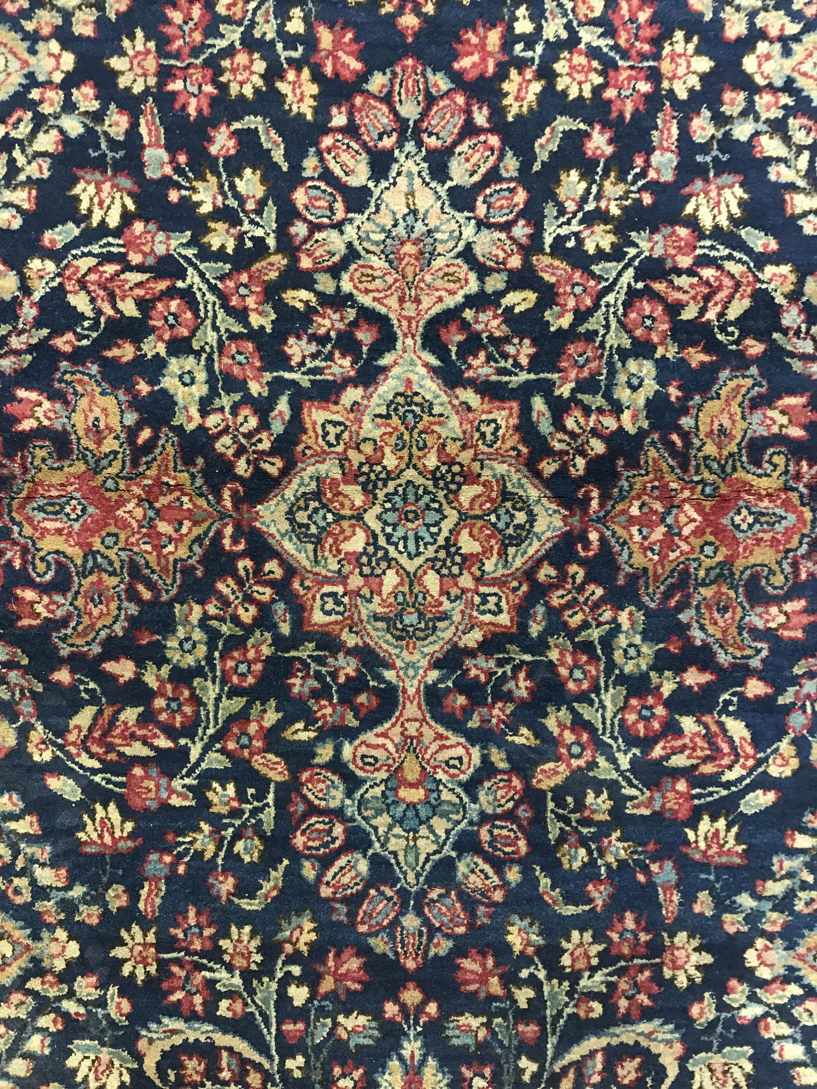Vintage Persian Area Rug: Vintage Persian are rug. Intricate multi toned floral patterns decorate carpet. Label on underside reads as MADE IN PERSIA. Measures approx 58 inches long, 35 inches W. Vintage carpet, rugs, area rug,