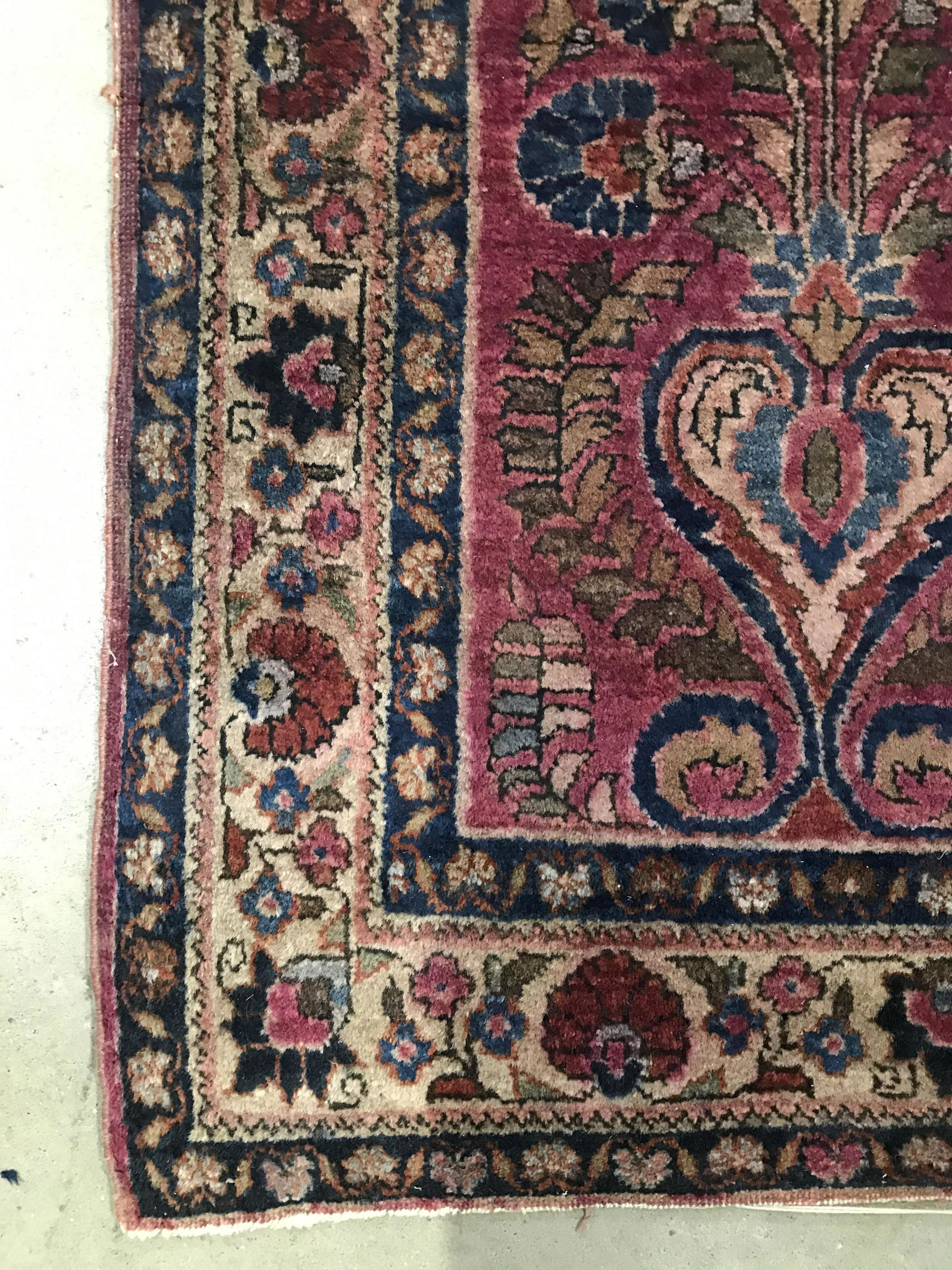 Antique Handmade Persian Wool Rug: Rug is wool and handmade. Piece appears to be antique. Rug contains intricate multi toned floral leaf and vine detail. Piece measures approximately 57 inches long 40 inches wide. Rug, carpet, area rug
