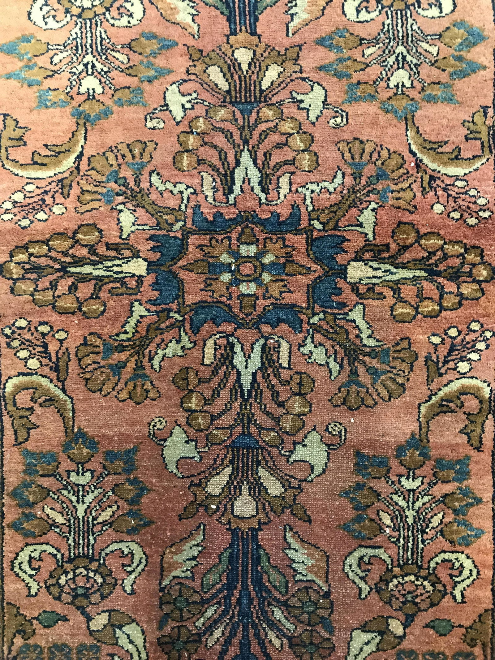 Antique Handmade Persian Wool Rug: Rug is wool and handmade. Piece appears to be antique. Rug contains intricate multi toned floral leaf and vine detail. Piece measures approximately 54 inches long 42 inches wide. Rug, carpet, area rug