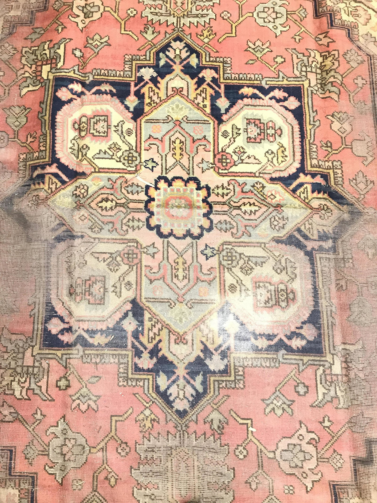 Vintage Handmade Turkish Wool Rug: Rug is wool and handmade. Piece appears to be vintage possibly antique. Rug contains intricate multi toned geometric detail. Piece measures 95 inches wide 140 inches long. Rug has significant wear, ha