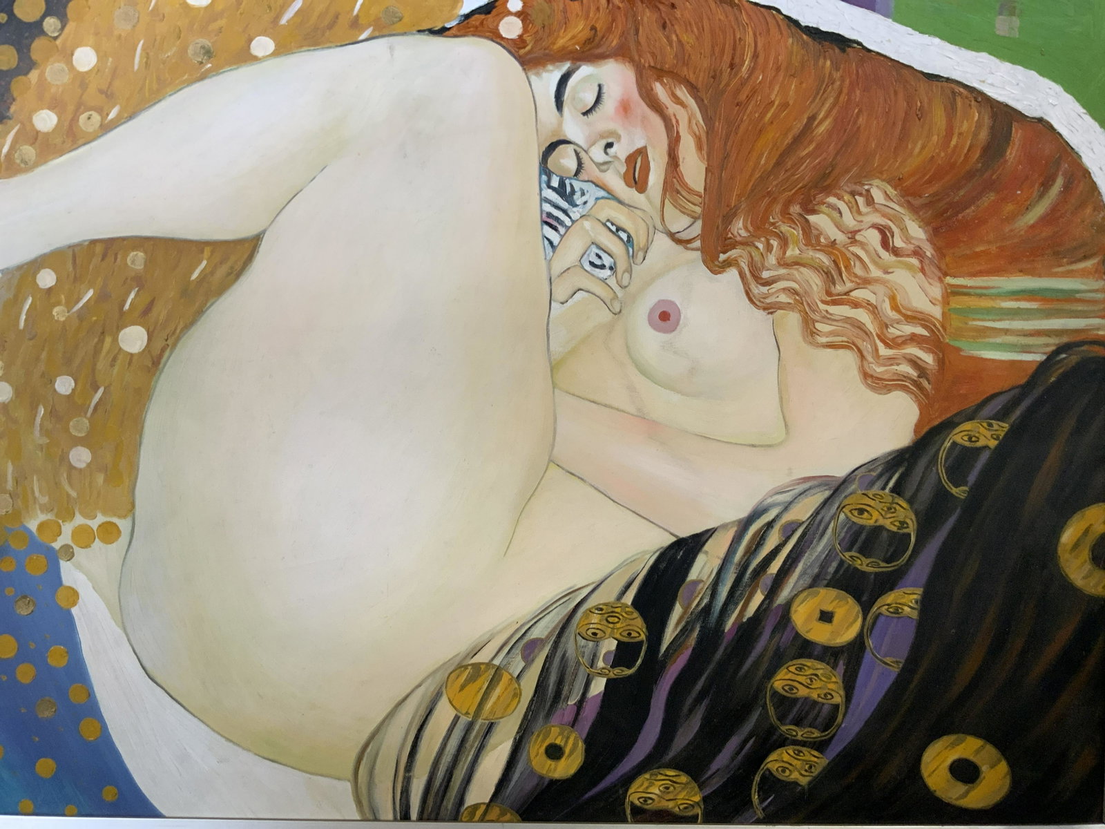 Danae Acrylic Painting in the style of KLIMT: Danae Acrylic Painting in the style of KLIMT, label to reverse details framing information, subject a nude reclining woman, measures 26 x 38 inches, silver painted wooden frame, professionally framed,