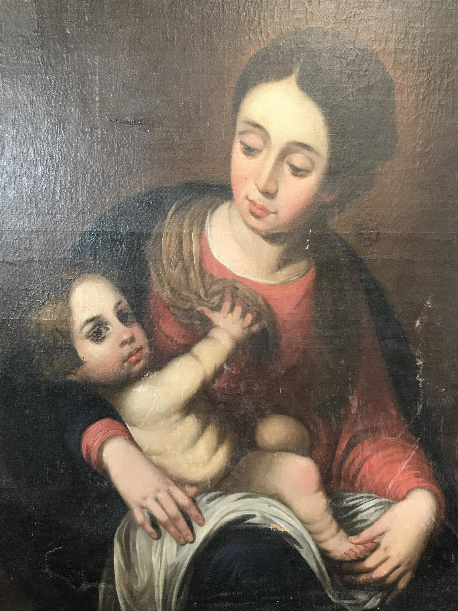 Oil on Canvas Mother and Child Artwork: Oil on canvas mother and child artwork, no apparent signatures or stamps, subject a portrait of a mother holding a child possibly Madonna and child in a semi renaissance style, wear and scuffs to edge