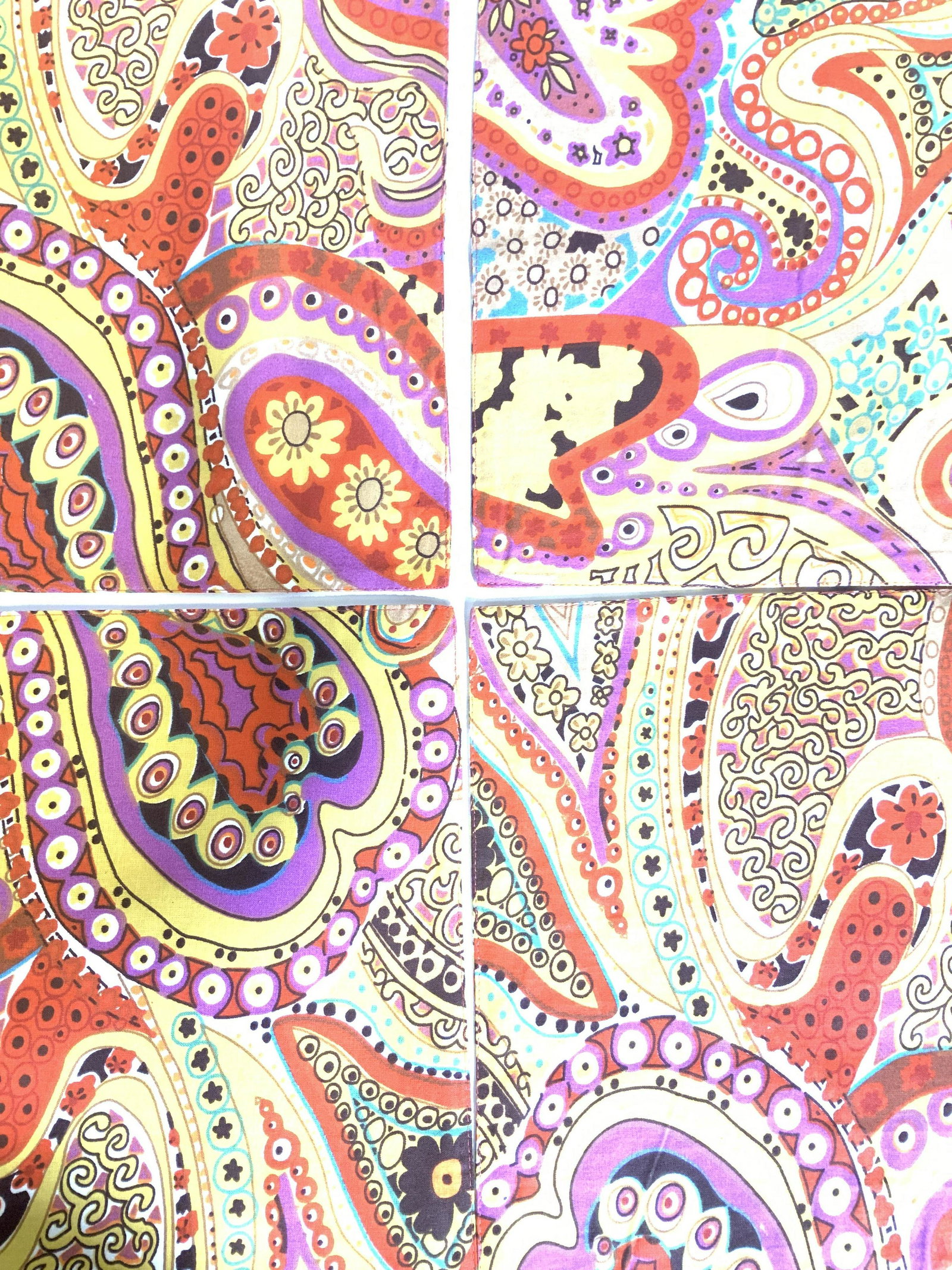 Set 5, INDIAN Linen Placemat & Runner Set: Bright orange, yellow, violet, green patina with creative paisley and other whimsical patterns. 4 placemats and 1 table runner. Bother have sturdy piece sewn in for stability. Linen fabric. Spot clean