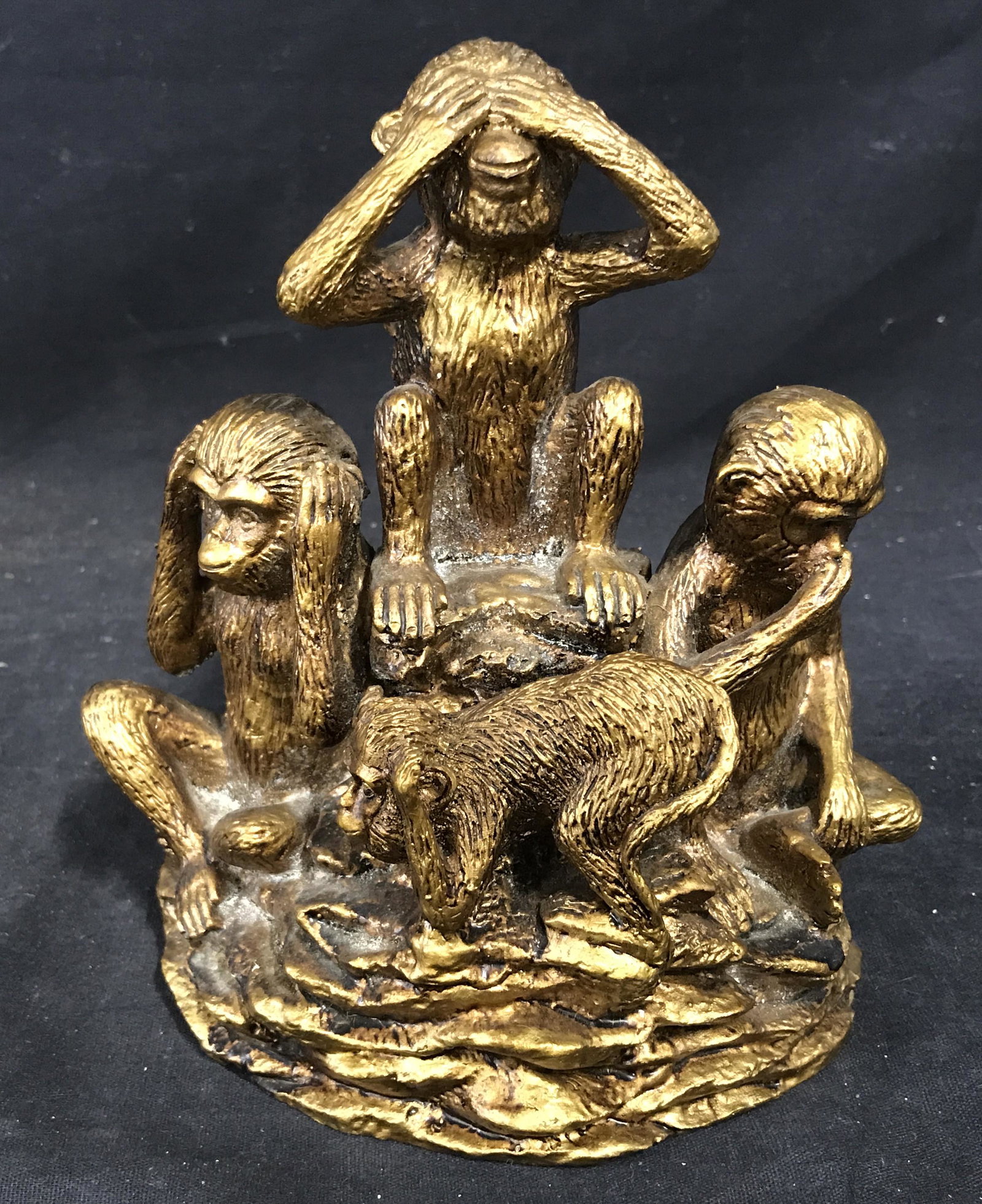 Composite Gold Painted Monkey bookend: Composite Gold Painted Monkey bookend, no apparent signatures or stamps, subject four monkeys in various poses each covering a part of themselves either the ears nose mouth of eyes, measures 7 inches 