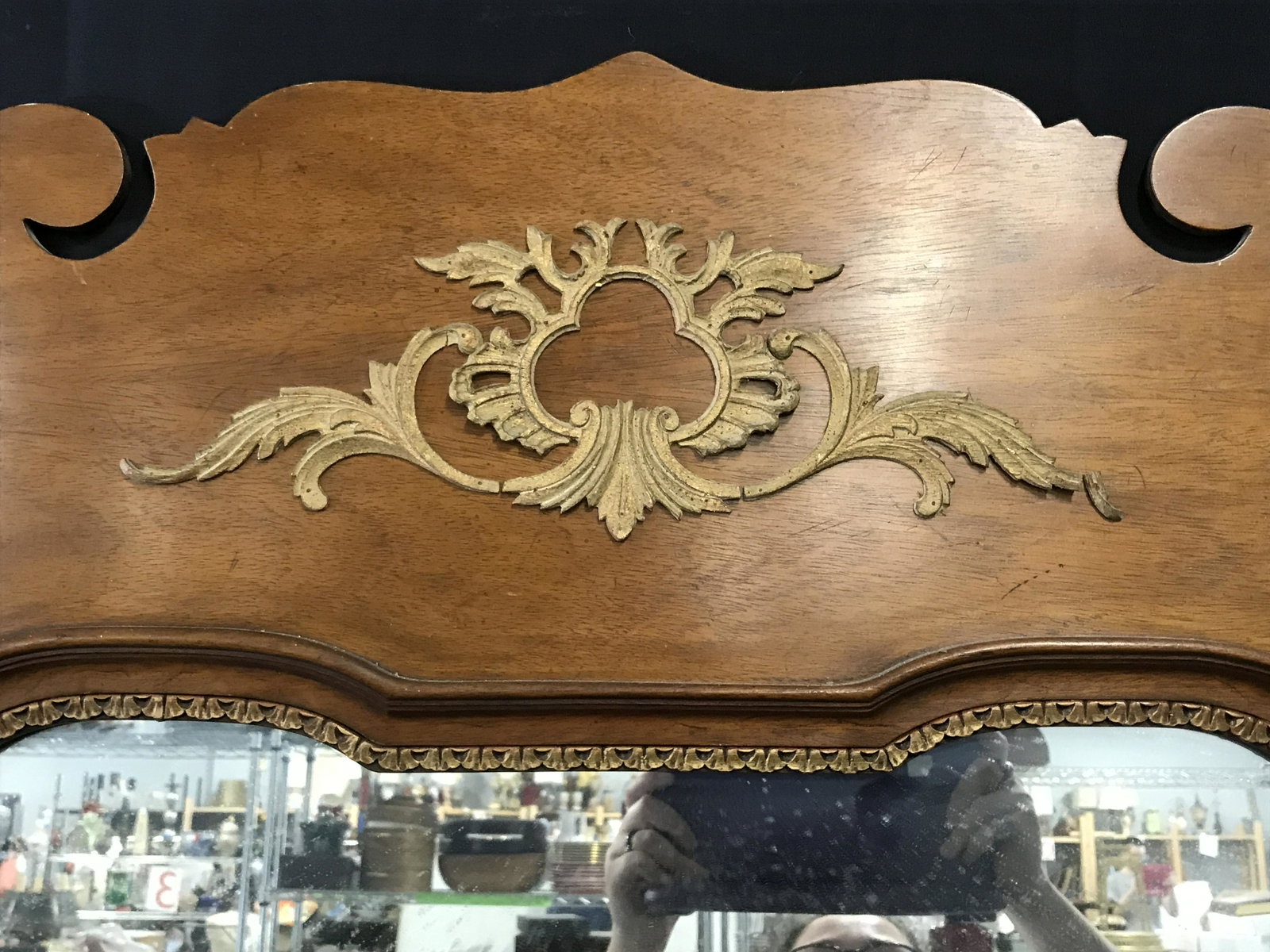 Mahogany Hand Carved Wooden Framed Mirror: Mahogany Hand Carved Wooden a framed Mirror, hand carved mahogany frame with metallic gold painted accents, top section of frame has a decorative piece installed on its surface, heavy weight object, m