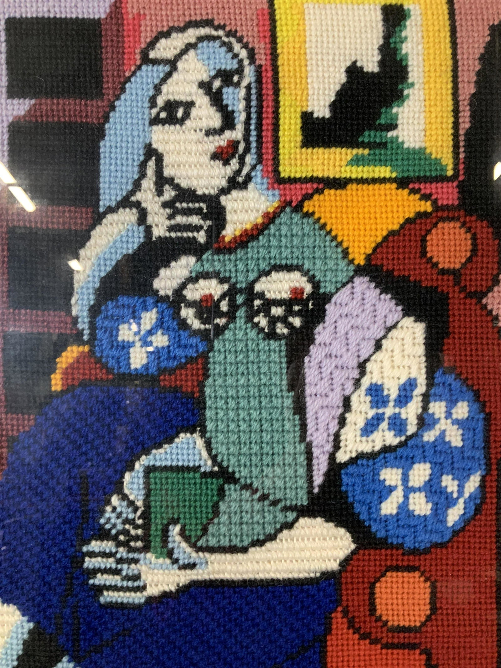 Cubist Style Needlepoint Artwork: Cubist Style Needlepoint Artwork, no apparent inscriptions or signatures, not examined out of frame, label to reverse reads ‘Keen Framing’, subject a woman sitting in a chair, measures 17 3/4 x 25