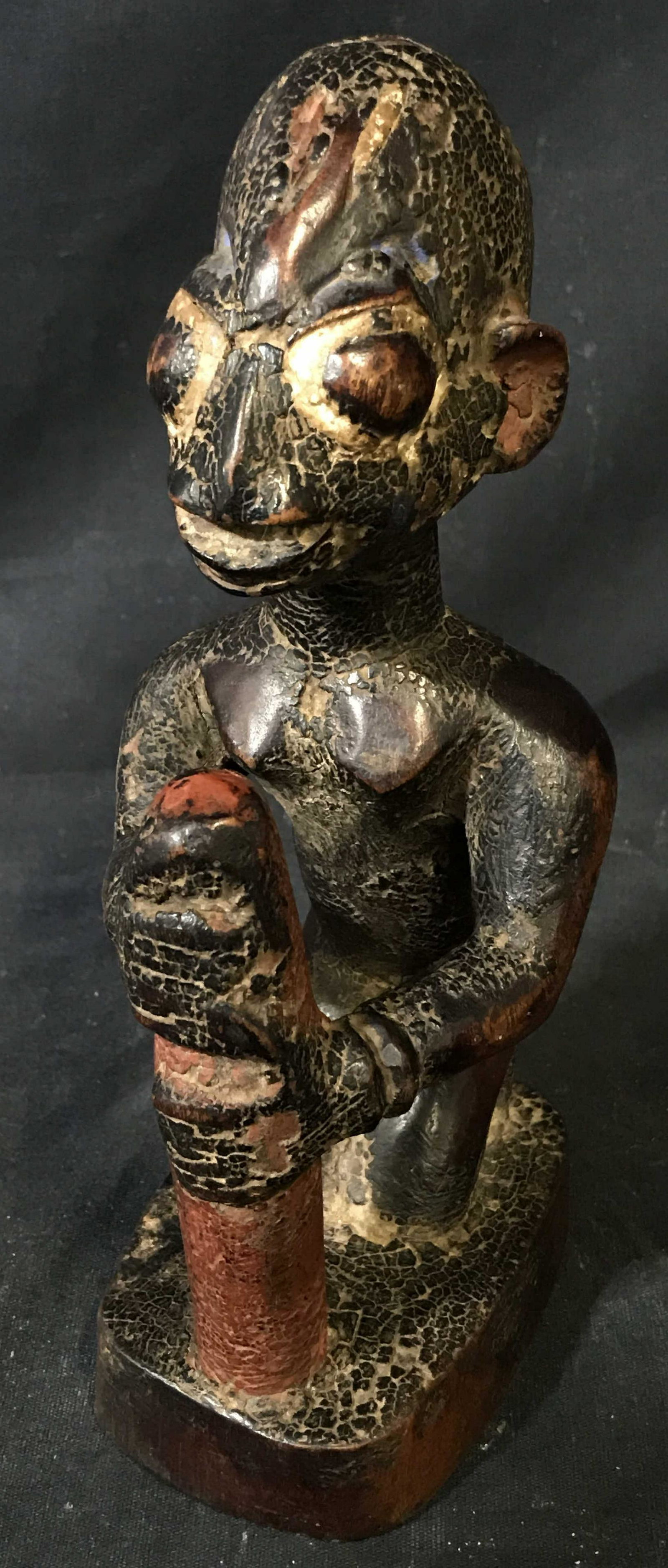 Nigerian Yoruba Ebeji Figure: Nigerian Yoruba Ebeji Figure, origins of the Yoruba people can be found in Nigeria West Africa, painted dark brown red and whit pigments, allowing for the rich hues of the dark wood to come through ex