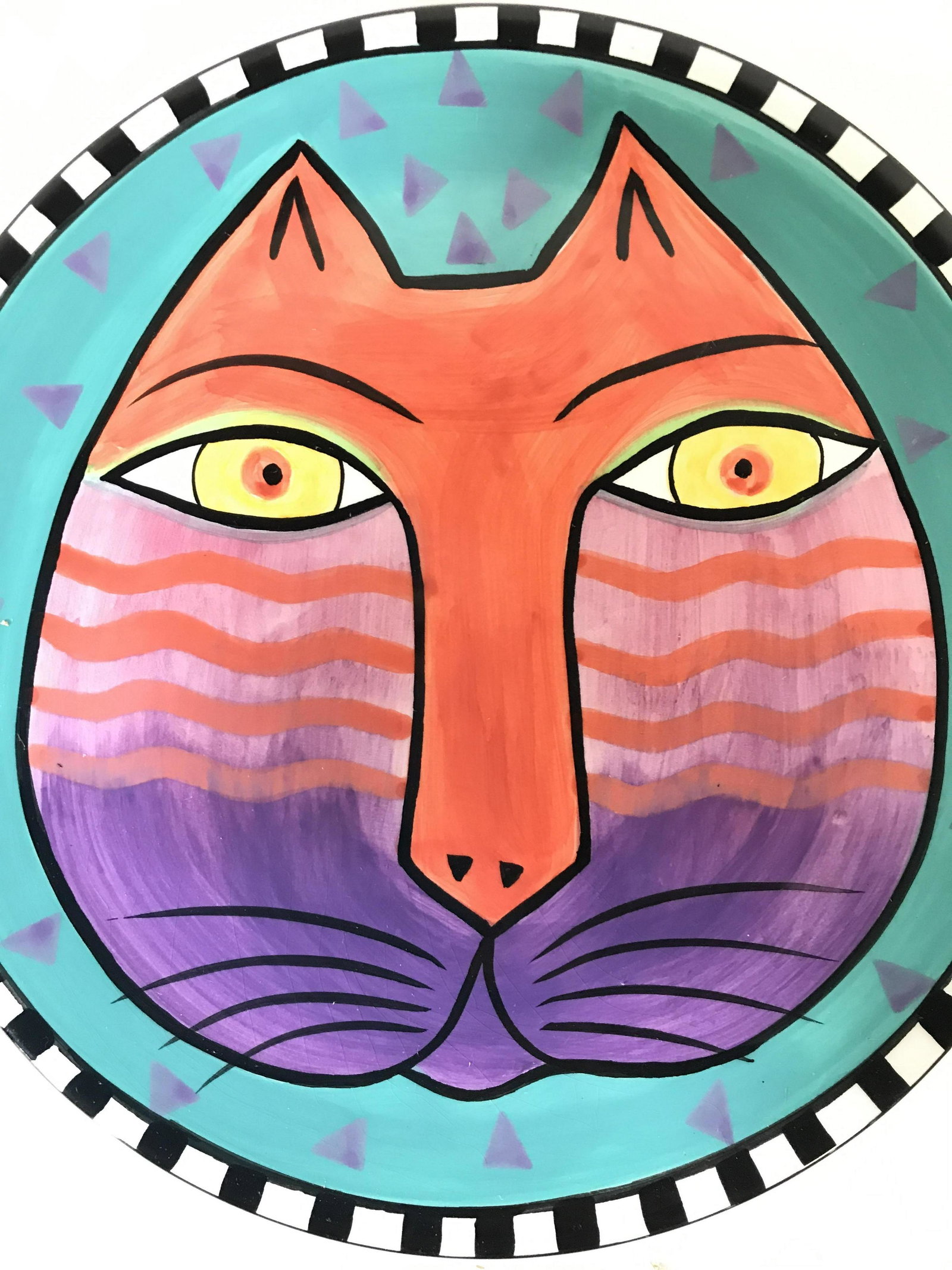 LAUREL BIRCH Porcelain Cat Face Plate: Underside of piece is marked LAUREL BIRCH. Center of plate has multi toned car face. Piece also has teal tone with purple toned triangle detail. Edges of plate have black & white toned pattern detail.