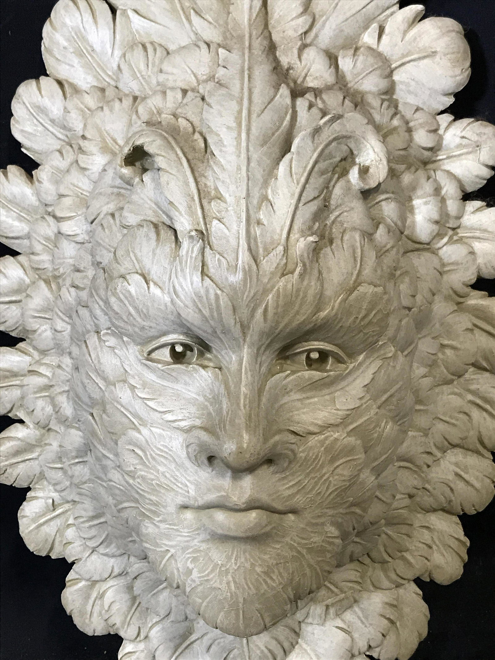 Tuscano Composite Green Man Wall Sculpture: Tuscano Composite Green Man Wall Sculpture, label to reverse reads ‘European Styled Sculpture hand crafted in China for design Tuscano’, subject a face completely covered in leaves otherwise known