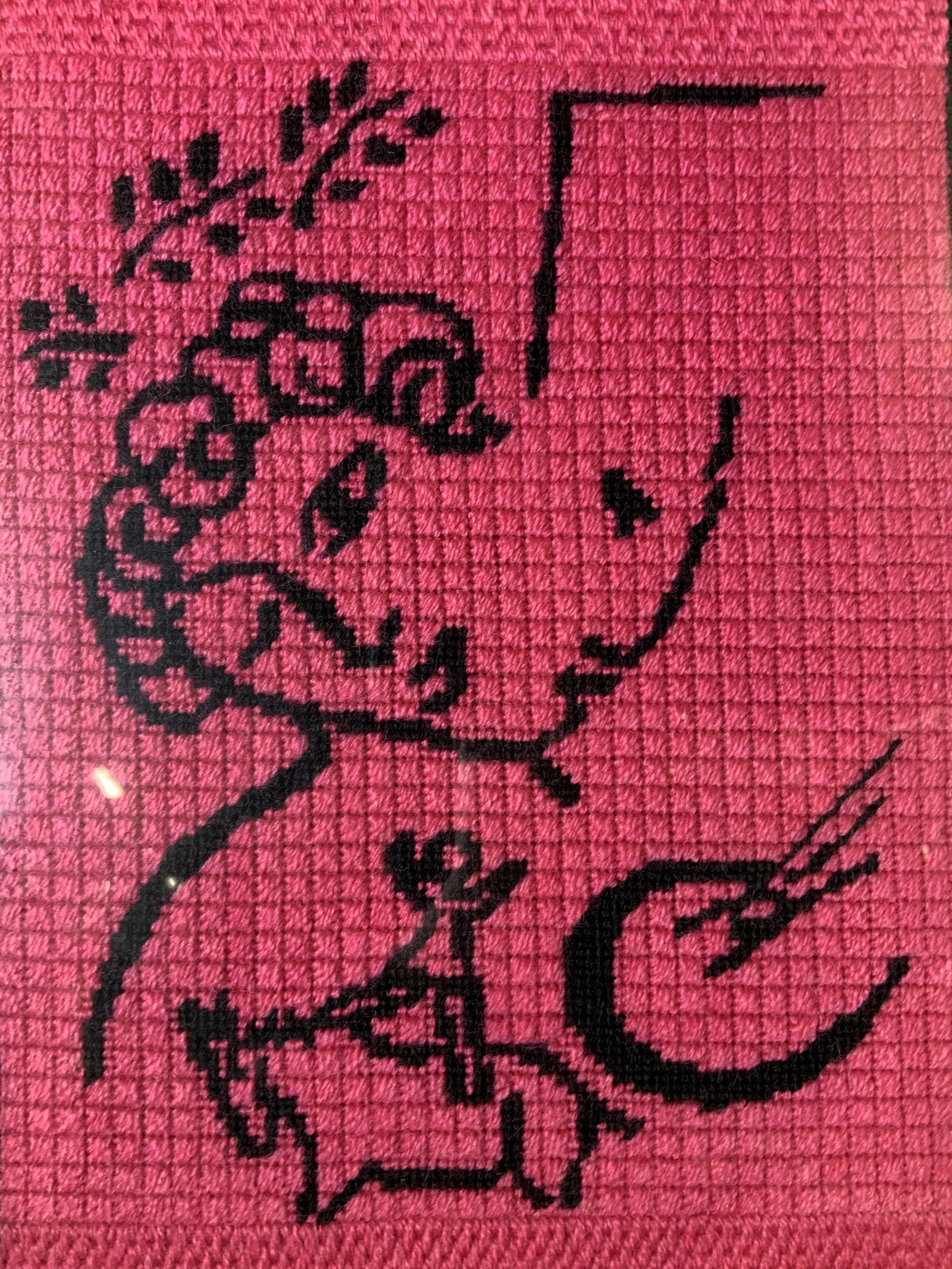 Needlepoint Artwork in the style of MARC CHAGALL: Needlepoint Artwork in the style of MARC CHAGALL, subject a figure over a person on a horse, measures 13 3/8 x 10 1/8 inches, silver toned metal frame, some scratches to frame but overall in good cond