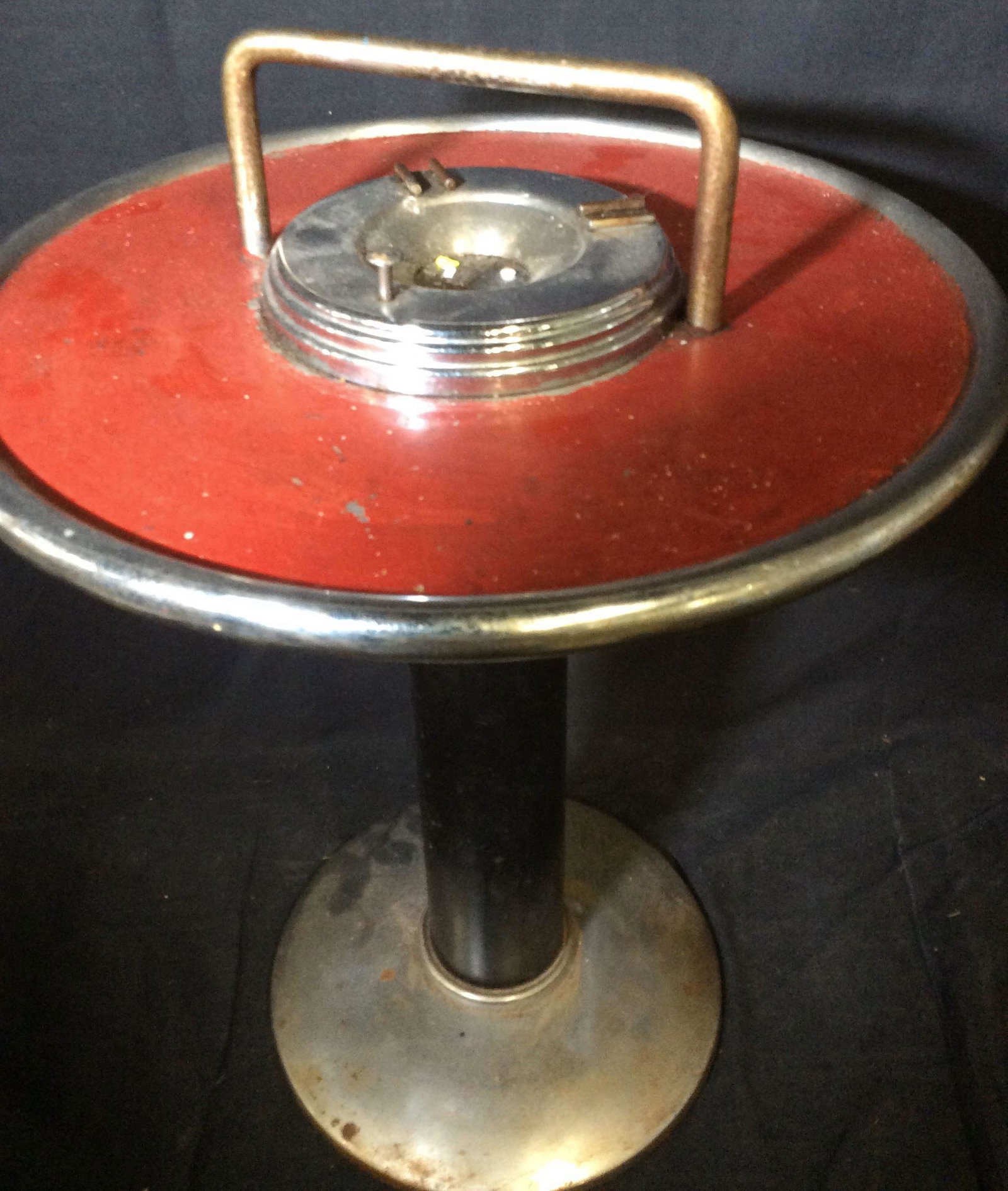 Vintage HOWELL Metal Ashtray Table, c. early 1900s: Art Deco Ashtray Table with red facade, chrome rims and base , black pedestal. Carry handle. Push button to deposite ashes. Moderate rust to metal. App 21.5 in ht. 5. In diameter. Manufacturer/ brand 