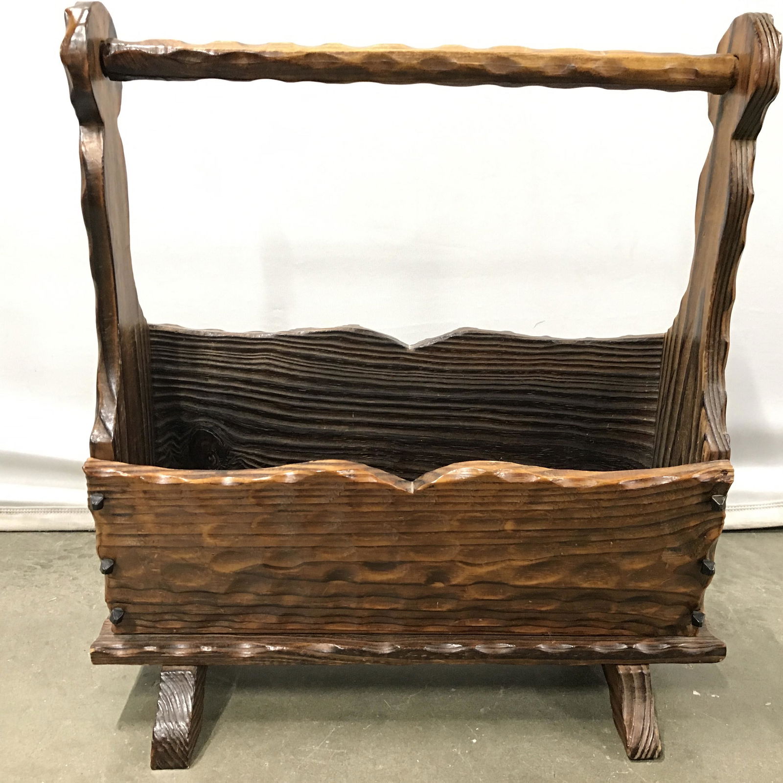 Vintage Carved Wooden Magazine Holder: Magazine holder is wooden. Piece appears to possibly be hand carved. Piece has handle at top. Magazine rack, magazine rack, magazine bin, newspaper holder, newspaper bin, wooden magazine holder. Piece