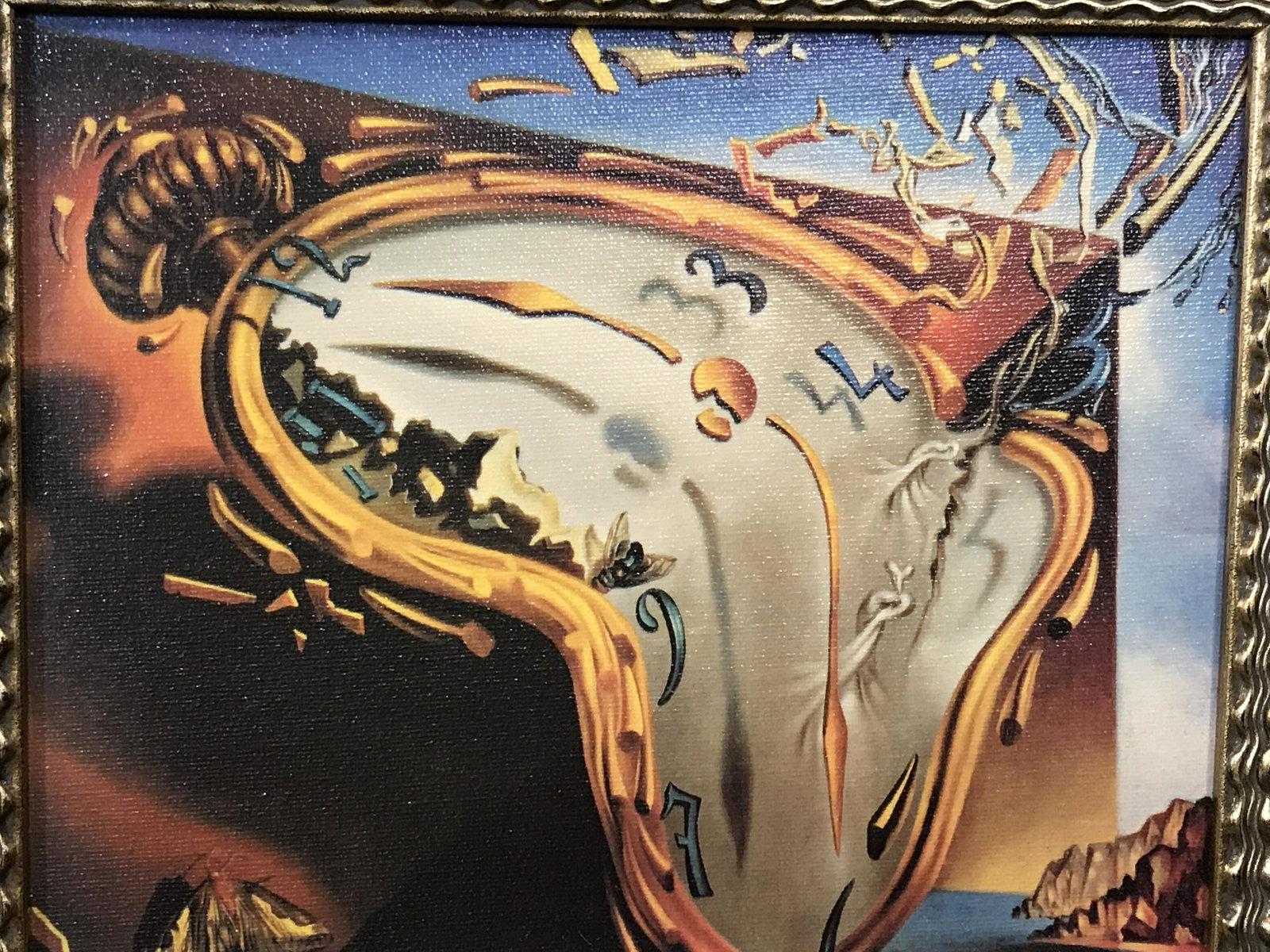 Framed Salvador Dali Print on Canvas Artwork: Framed Salvador Dali Print on Canvas, plaque to frame reads ‘Melting Clock Salvador a Dali 1904-1989’, subject a surrealist clock melting in front of an abstract background, black and gold wooden 
