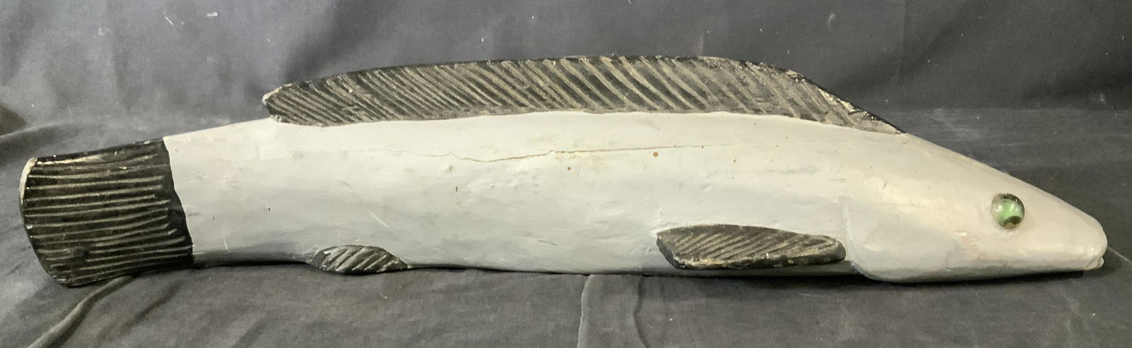 Grey Bozo Fish Sculpture, Mali, West Africa: Grey Bozo Fish Sculpture, Mali, West Africa, no apparent inscriptions or signatures, hand carved and painted with gray and black pigment, embedded glass eyes, measures 18 1/4 x 5 inches at widest poin