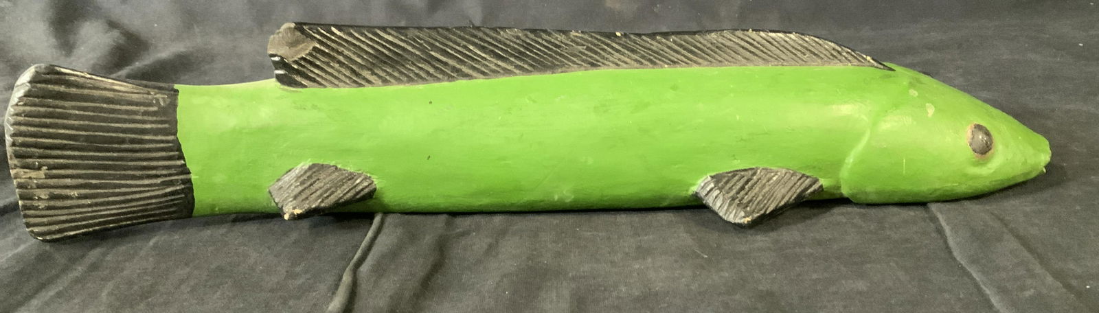 Bozo Fish Sculpture, Mali, West Africa: Bozo Fish Sculpture, Mali, West Africa, no apparent inscriptions or signatures, hand carved and painted in green and black pigment, embedded glass eyes, measures 15 3/8 x 3 3/4 inches at widest point,