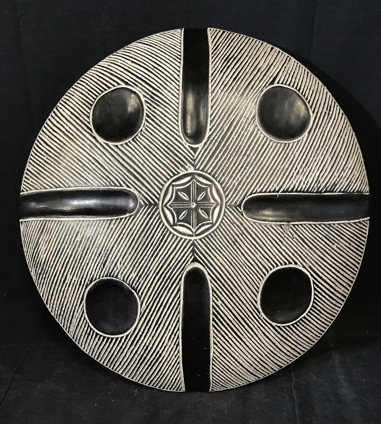 Traditional South African Tribal Shield: traditional South African tribal Shield, origins can be found in South Africa, wooden shield with black and white paint with a snowflake pattern carved into the front, handle carved into the back, dia