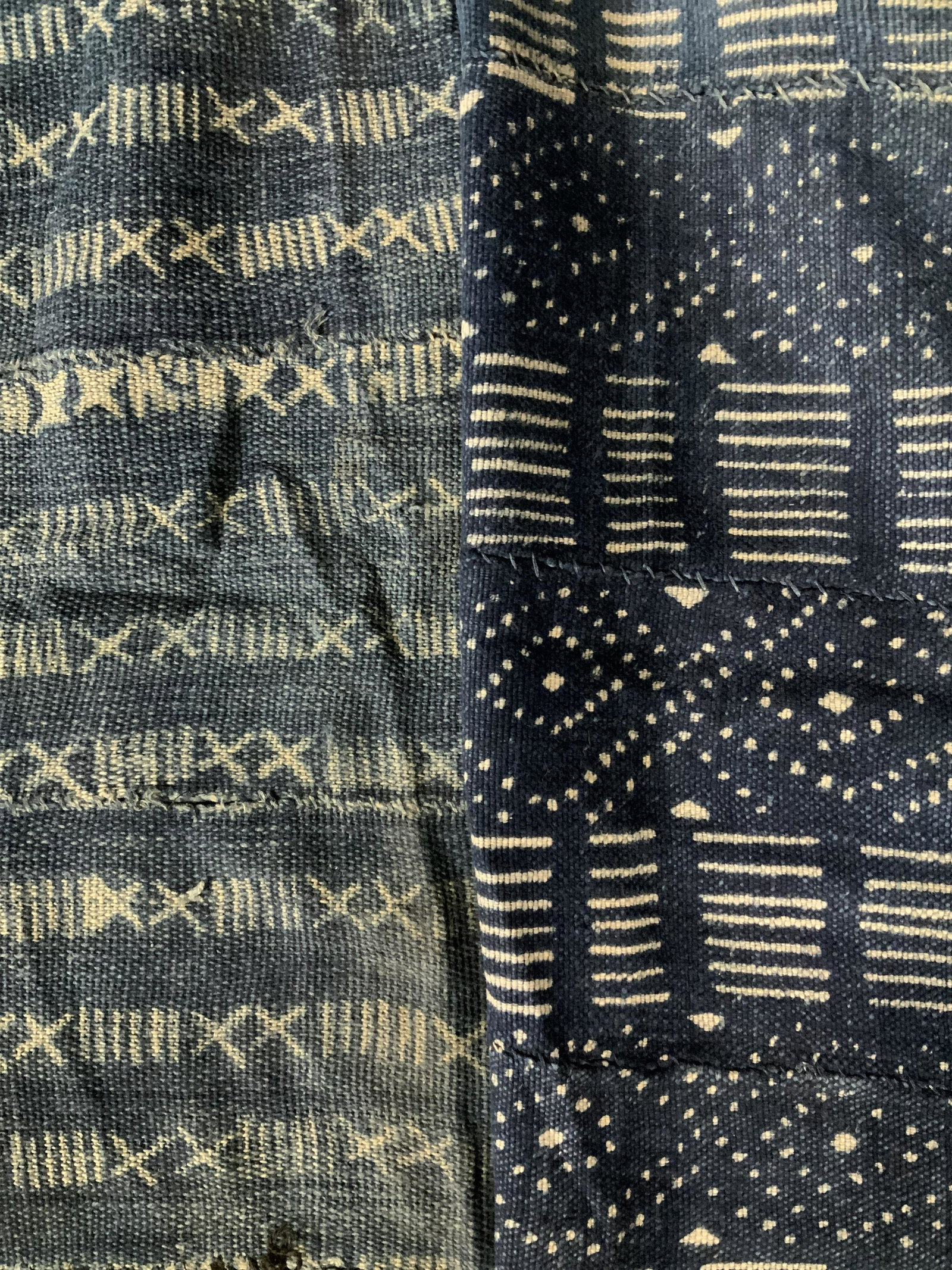 Lot 2 Vintage West African Textiles: Lot 2 Vintage West African Textiles, no apparent inscriptions or labels, possibly from Mali, Burkina Faso, or Ivory Coast, abstracted patterns, darker blue fabric measures 59 x 41 1/2 inches, other fa
