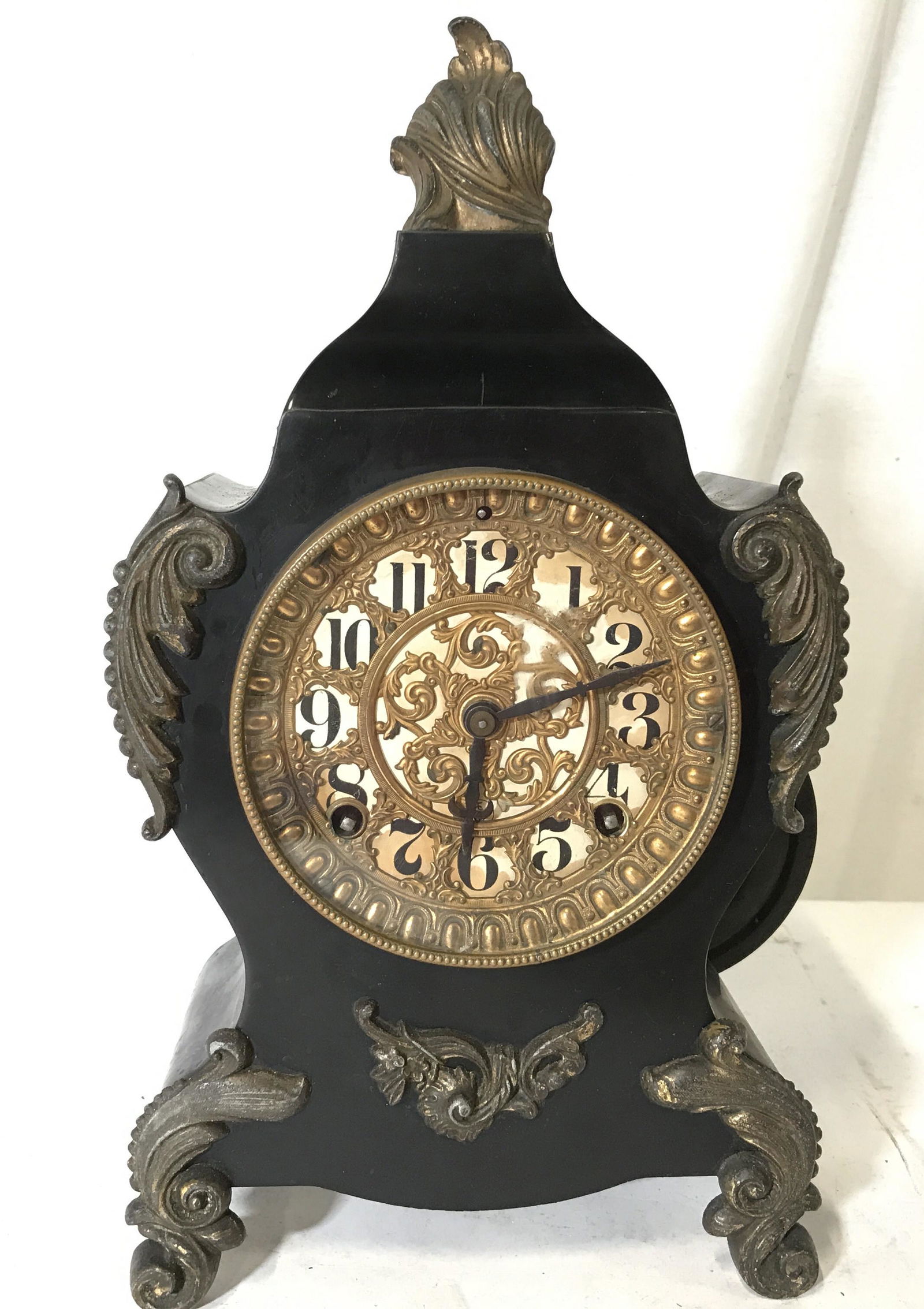 Vintage ANSONIA CLOCK CO Metal Mantle Clock: Vintage, possibly antique mantle clock. Ornately detailed clock face, detailing is crafted from brass, possibly gilded white metal. Measures approx 14 inches H, and 7.5 inches W. Internal etching read