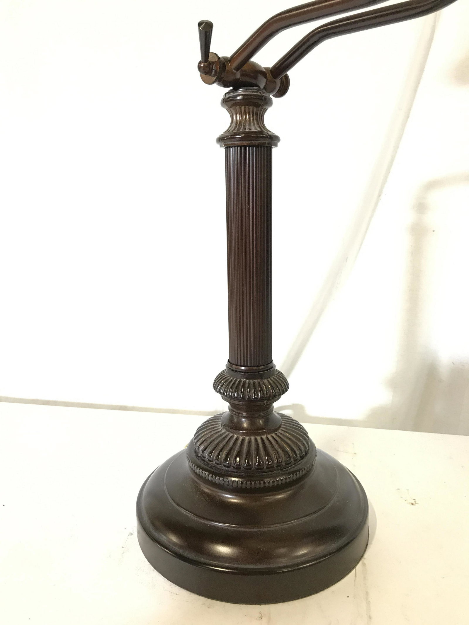 Metal Table Top Adjustable Lamp: Metal adjustable lamp. Metal is bronze toned, columnar body is reeded. Measures approx 28.75 inches H, fully extended, and 7 inches W. Wear is consistent with age and use. Lamps, lighting, table acces