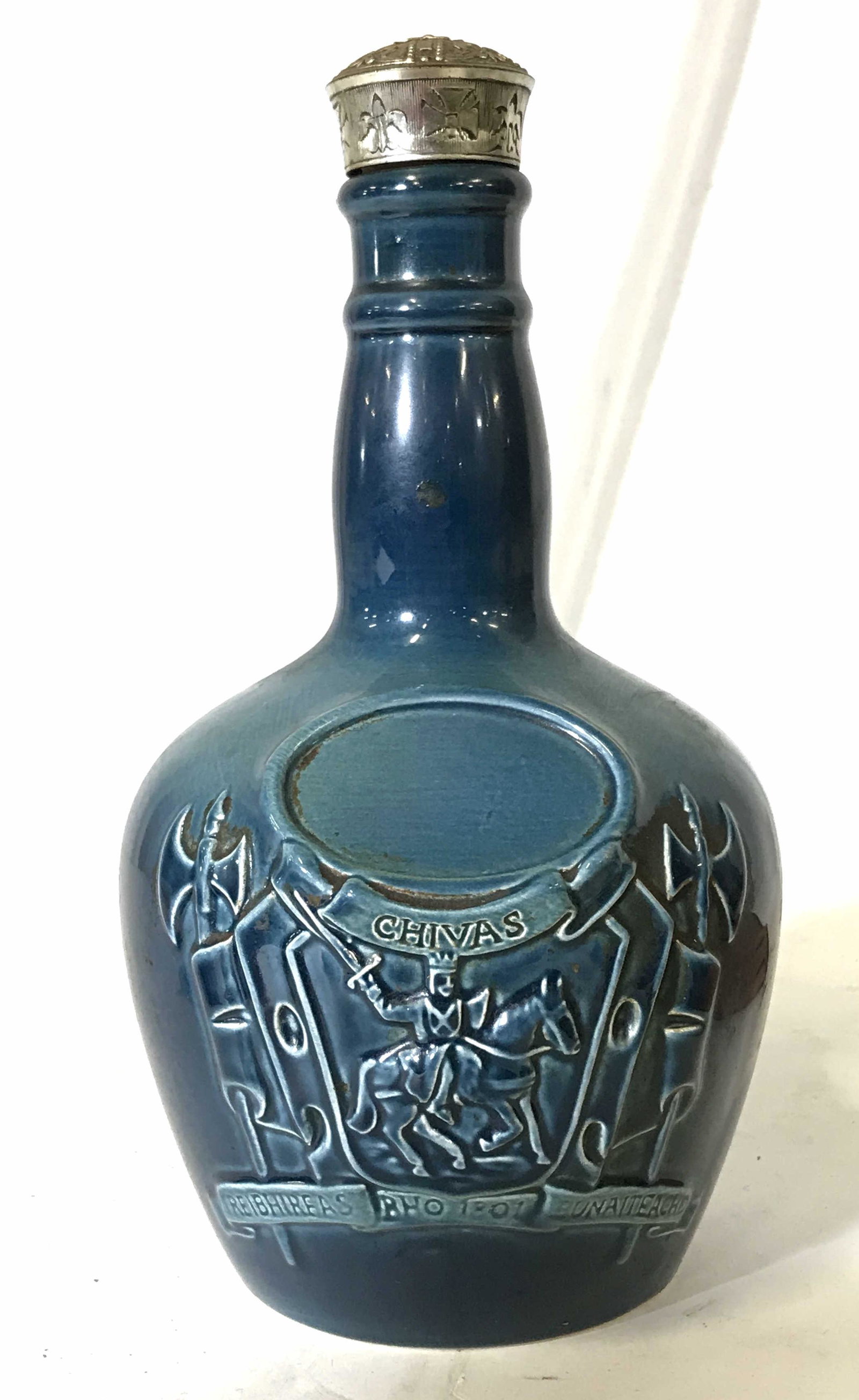 SPODE Ceramic CHIVAS BROTHERS Decanter: Vintage SPODE ceramic bottle. CHIVAS BROTHER collectible whiskey bottle, underside reads as CHIVAS BROTHERS LTD, ABERDEEN SCOTLAND. Depicts a knight atop a horse flanked by flag wrapped pole arms. Cor