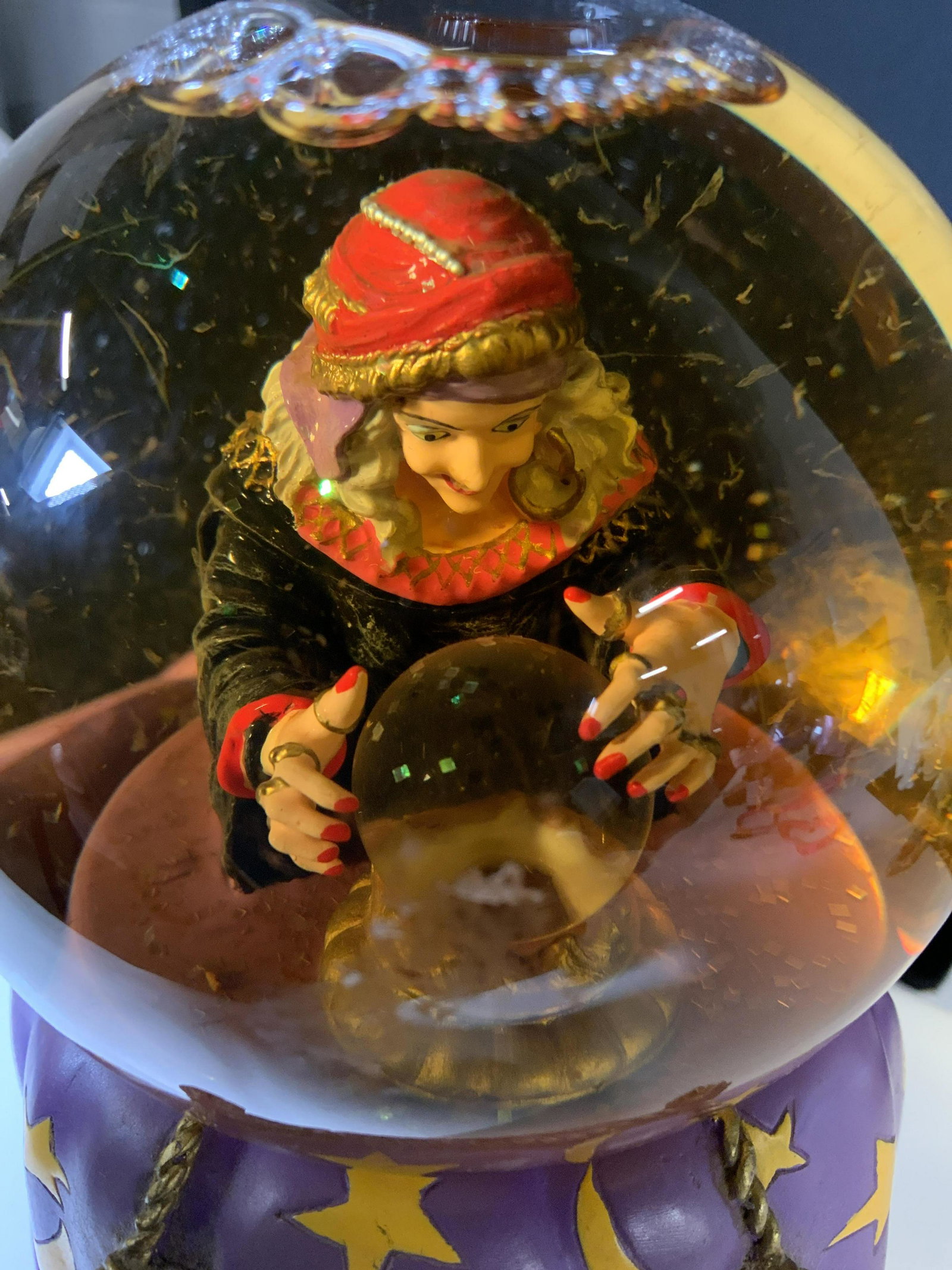 DEPARTMENT 56 Mdm Zeldas Fortunes Snow Globe: Vintage water globe that lights up, uses 2 AA BATTERIES with on/ off switch. Underside there is a fortune bobble with messages. A sculpted Mdm. Zelda sits inside the large glove touching her own cryst