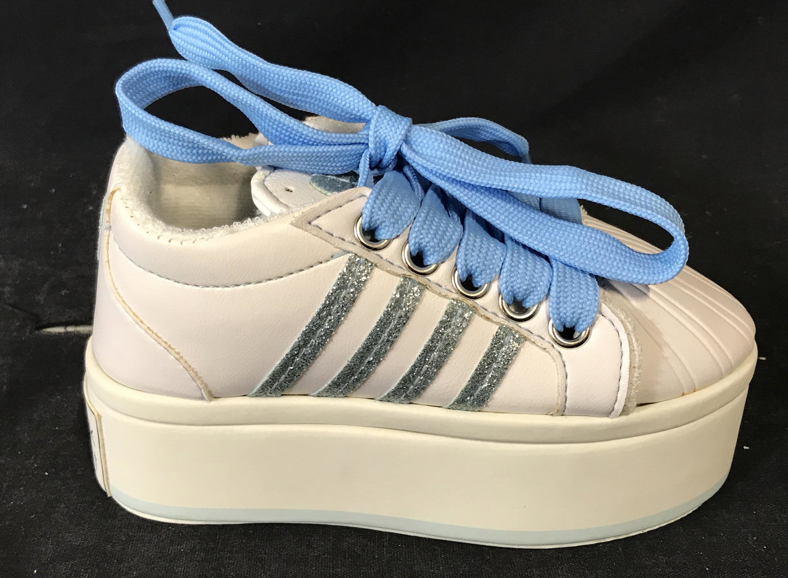 Decorative Sneaker Jewelry Box: Decorative Sneaker jewelry box, piece designed to appear as a child’s white with blue accents, opens up midway to reveal a light denim interior that has two box areas and a ring cushion section, mea