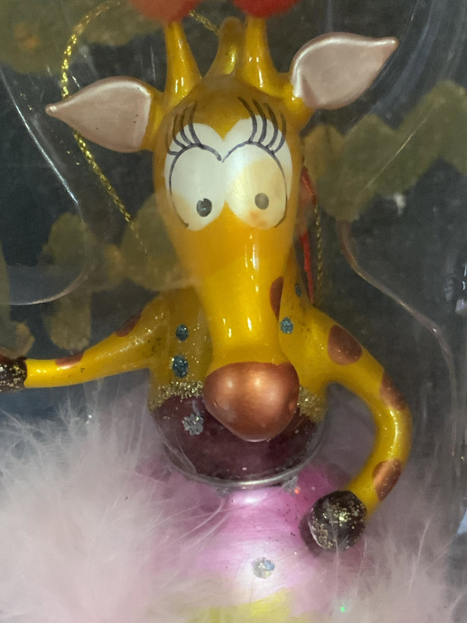 Glass Giraffe In Tutu Tree Ornament, Org Box: Whimsical Christmas Tree Ornament or Fun Decorative Ornament Of Silly Giraffe with ruby sparkle slippers wearing a feather tutu. Hand painted. In original box with proper padding. Box measures 9 x 4 i