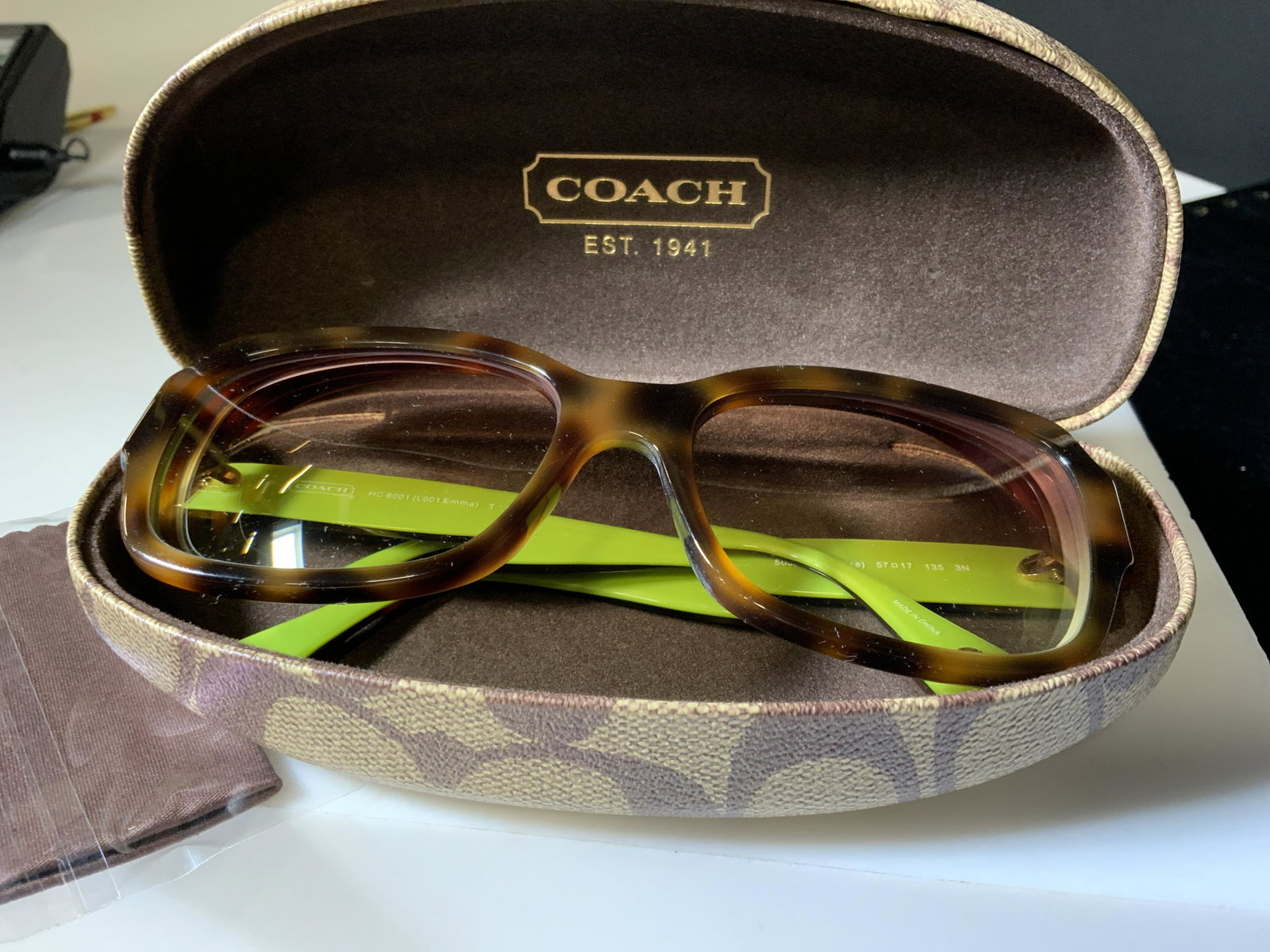 Luxury COACH EMMA Sun Glasses With Hard Case: Logo Coach tortoise shell style square shape glasses with lime green temple rims. Style HC 8001 (L001 Emma) 57/17 135 mm, Tortoise Color #5052/13. Frames are in good condition. Includes designer Logo 