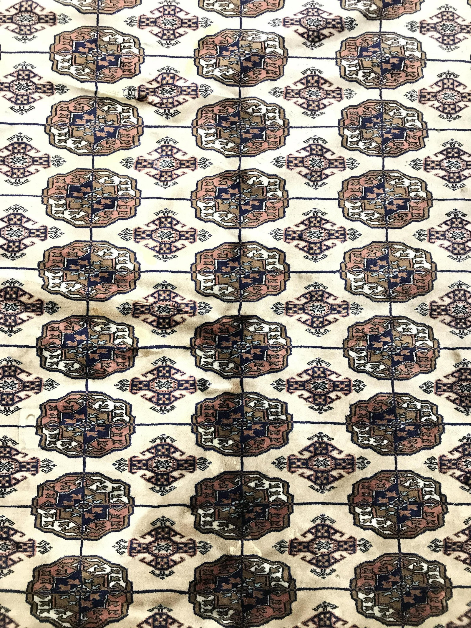 Vintage Handmade Pakistani Fringed Wool Rug: Rug is wool and handmade. Piece is vintage possibly antique. Rug contains intricate multi toned geometric detail. Piece measures approximately 10 feet long by 8.3 feet wide. Rug, carpet, area rug, roo