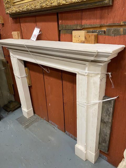 Salvaged Limestone Fireplace Mantel: Mantel is an authentic salvaged limestone mantel. It is in good condition, some wear consistent with age. Assembly required, 6 pieces. Piece has significant weight. The dimensions are 60w x 44.5h and